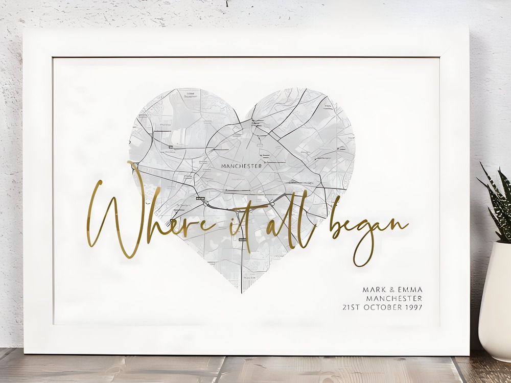 Framed heart-shaped map of Manchester featuring the inscription, "Where our wedding journey began," along with our special date. A timeless memento for our destination wedding.
