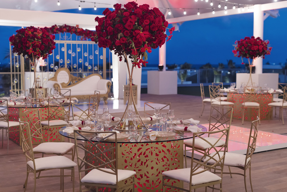 Chic rooftop wedding setup at dusk&mdash;ideal for unforgettable destination wedding celebrations.