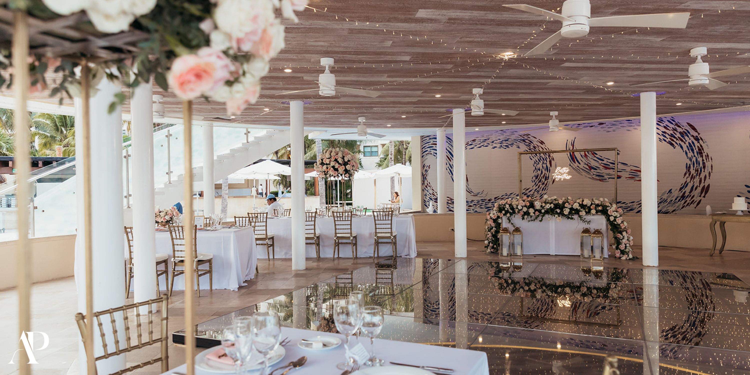 Elegant Dreams Riviera Cancun destination wedding with beautifully decorated tables and floral arrangements.