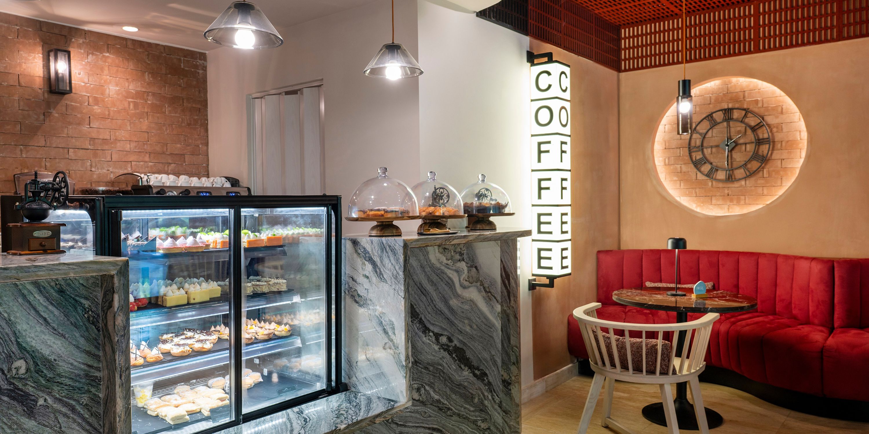 Grand Palladium Bavaro&rsquo;s modern caf&eacute;, ideal for destination weddings, has dessert displays and red booths.