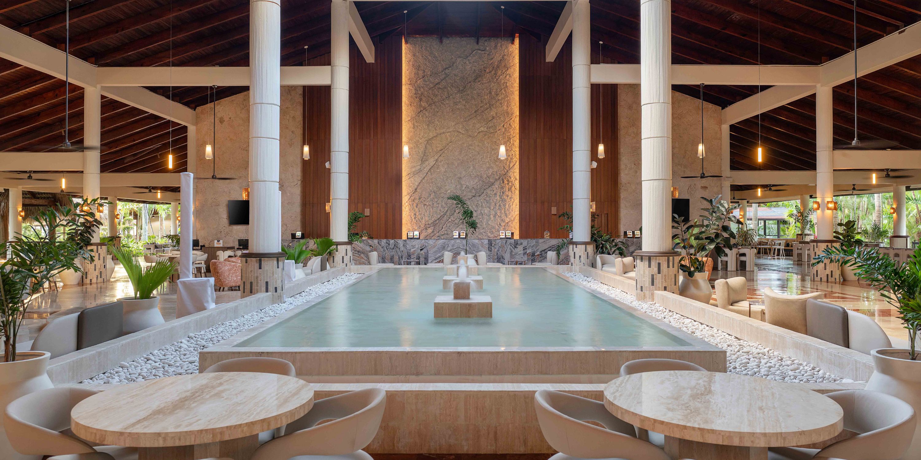 Grand Palladium Bavaro hotel&rsquo;s spacious lobby with reflecting pool is ideal for a destination wedding.