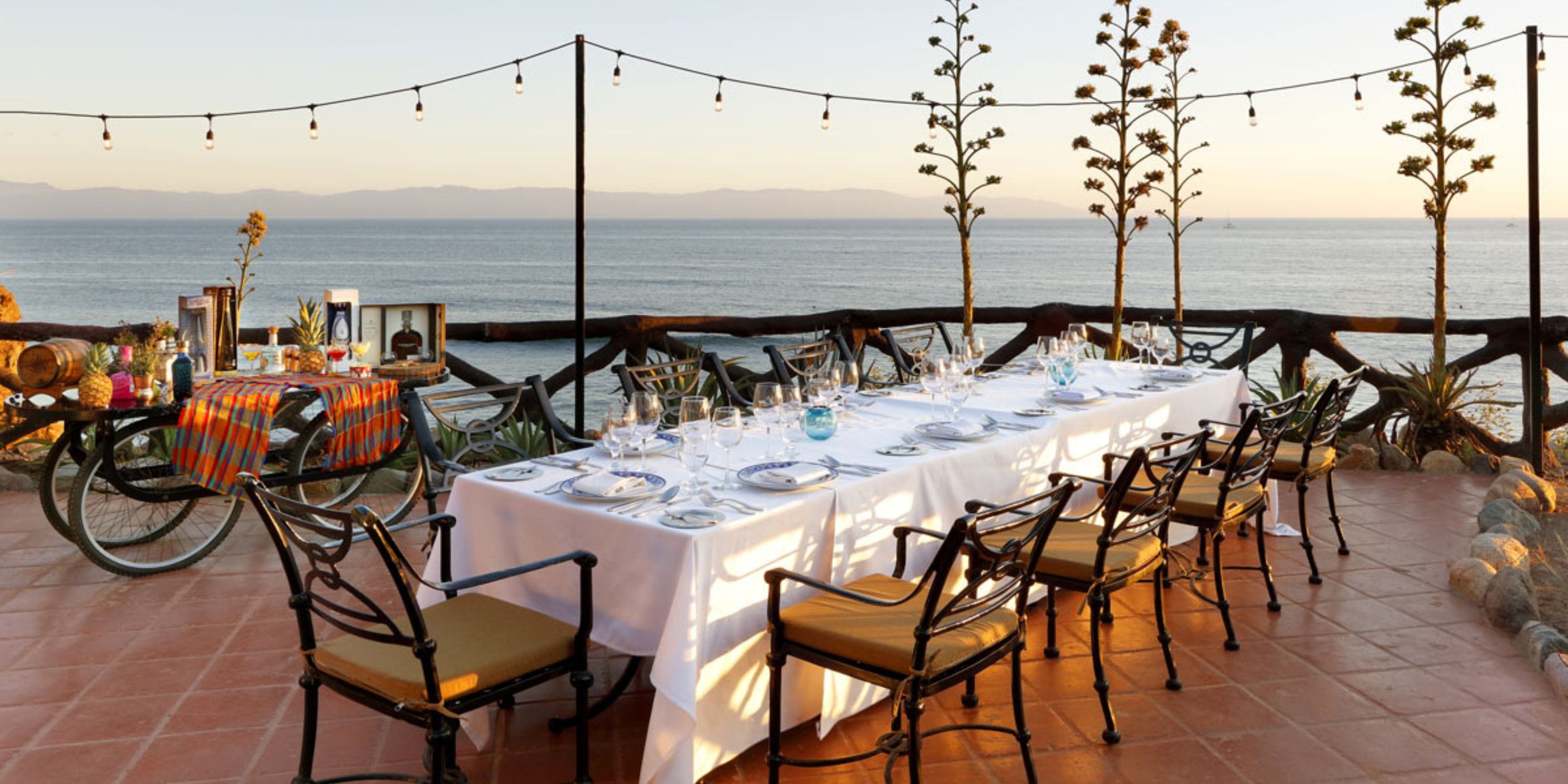 Grand Palladium Vallarta patio dining set, ideal for destination wedding sunset ocean views.