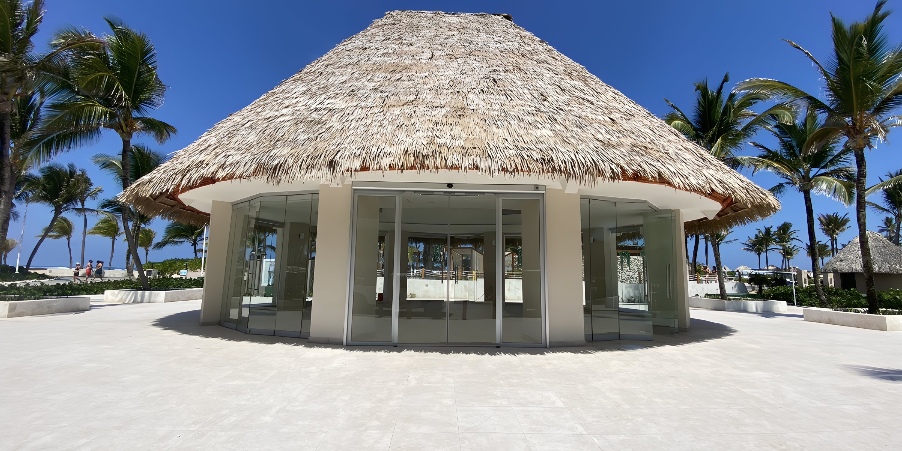 A round glass hut with a thatched roof, perfect for a destination wedding at Hard Rock Punta Cana.