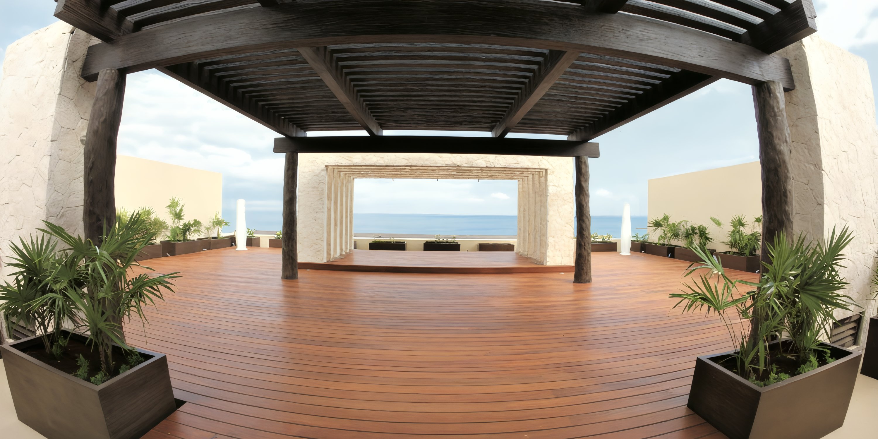 Open wooden terrace with a large pergola, potted plants, and an ocean view&mdash;ideal for a destination wedding.