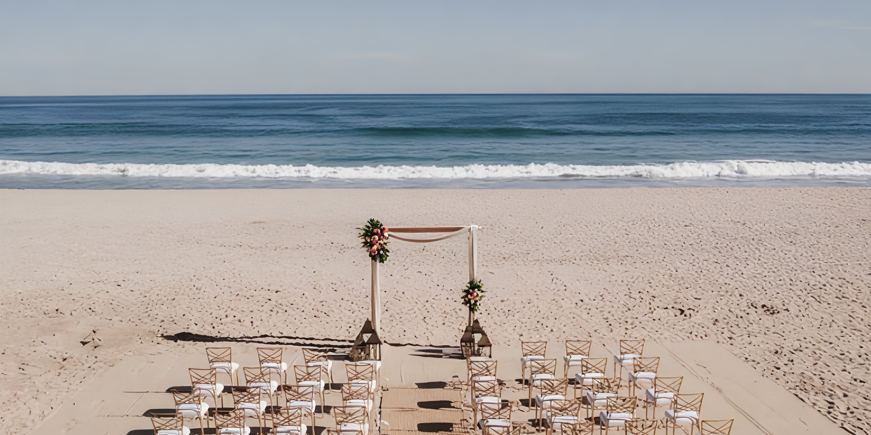 Destination wedding ceremony arranged on the sandy beach at Hyatt Ziva Los Cabos.