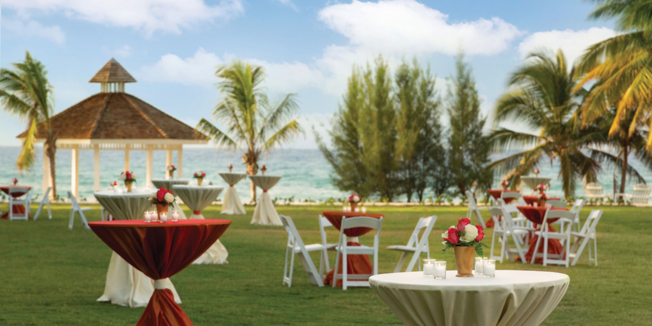 Experience a breathtaking destination wedding at Hyatt Zilara Rose Hall, where you can exchange vows seaside amidst stunning floral arrangements, elegant gazebos, and palm-topped tables.