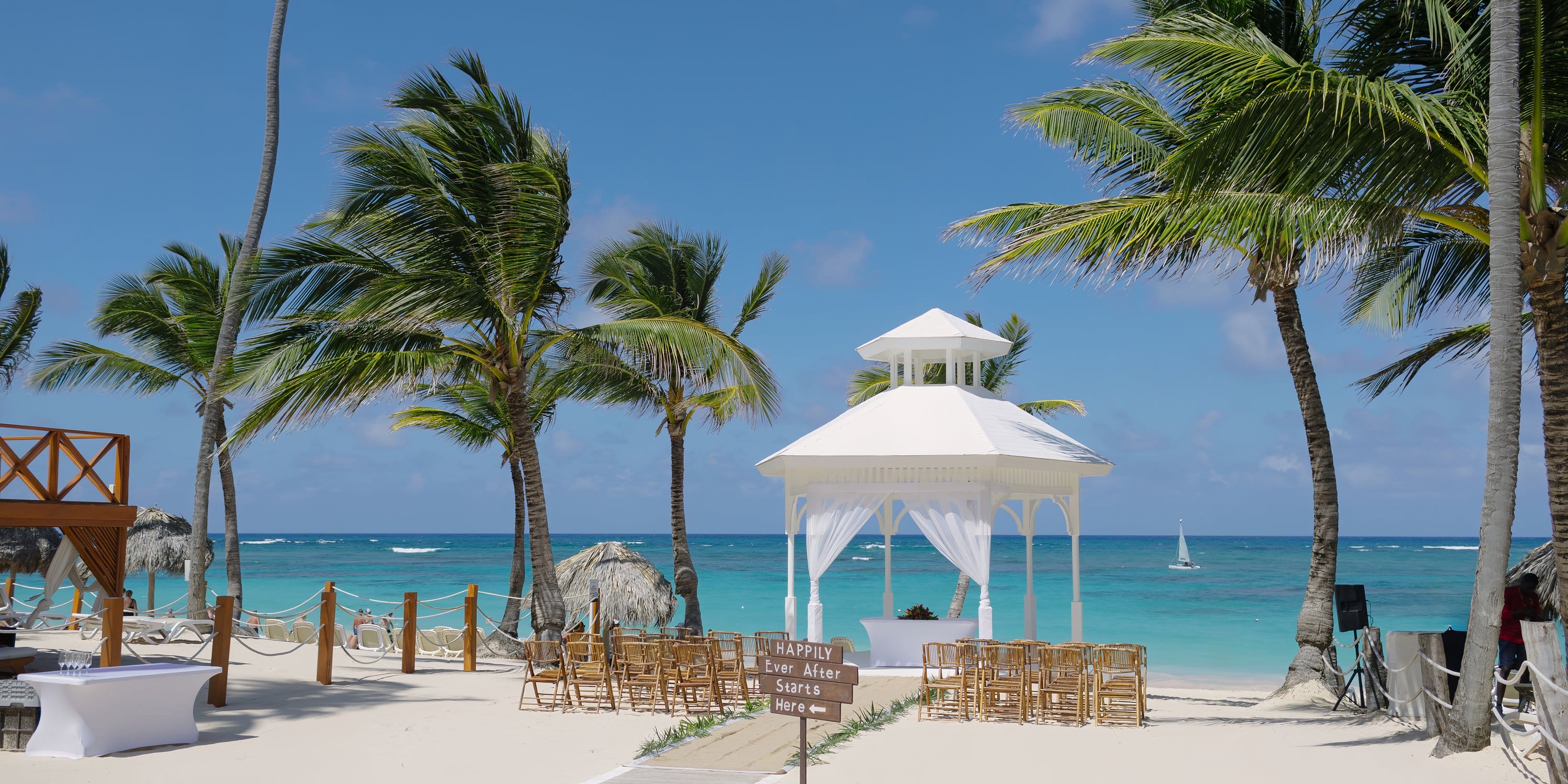 Majestic Mirage Punta Cana: gazebo, chairs, palms, ocean views—perfect destination wedding scene.