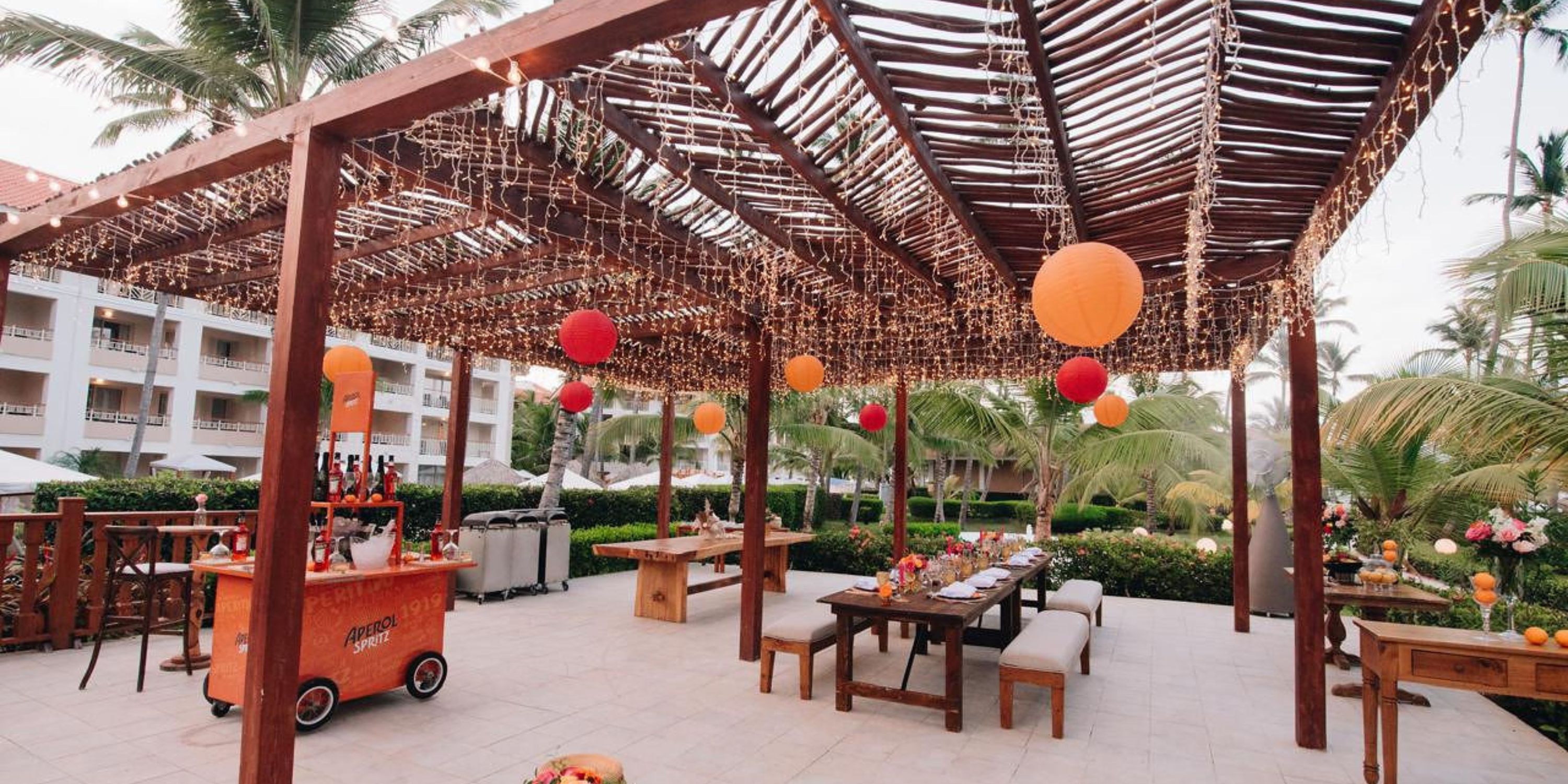 Scenic outdoor patio with pergola and string lights, ideal for a destination wedding at Majestic Mirage.