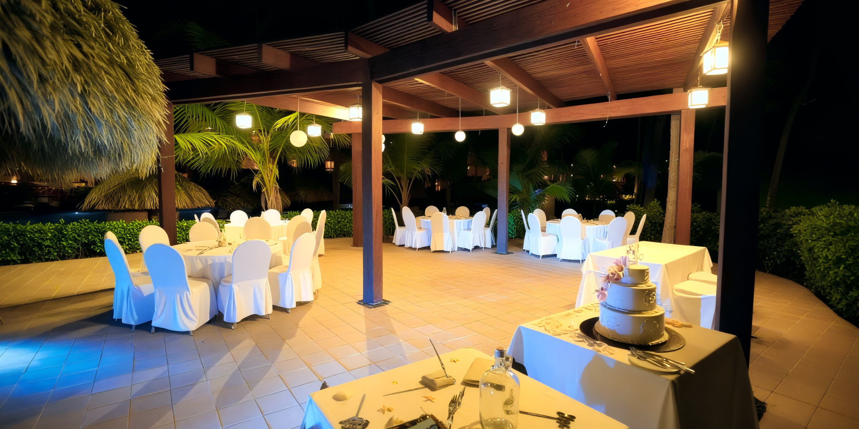 Nighttime view of Majestic Colonial outdoor venue, perfect for a romantic destination wedding event.