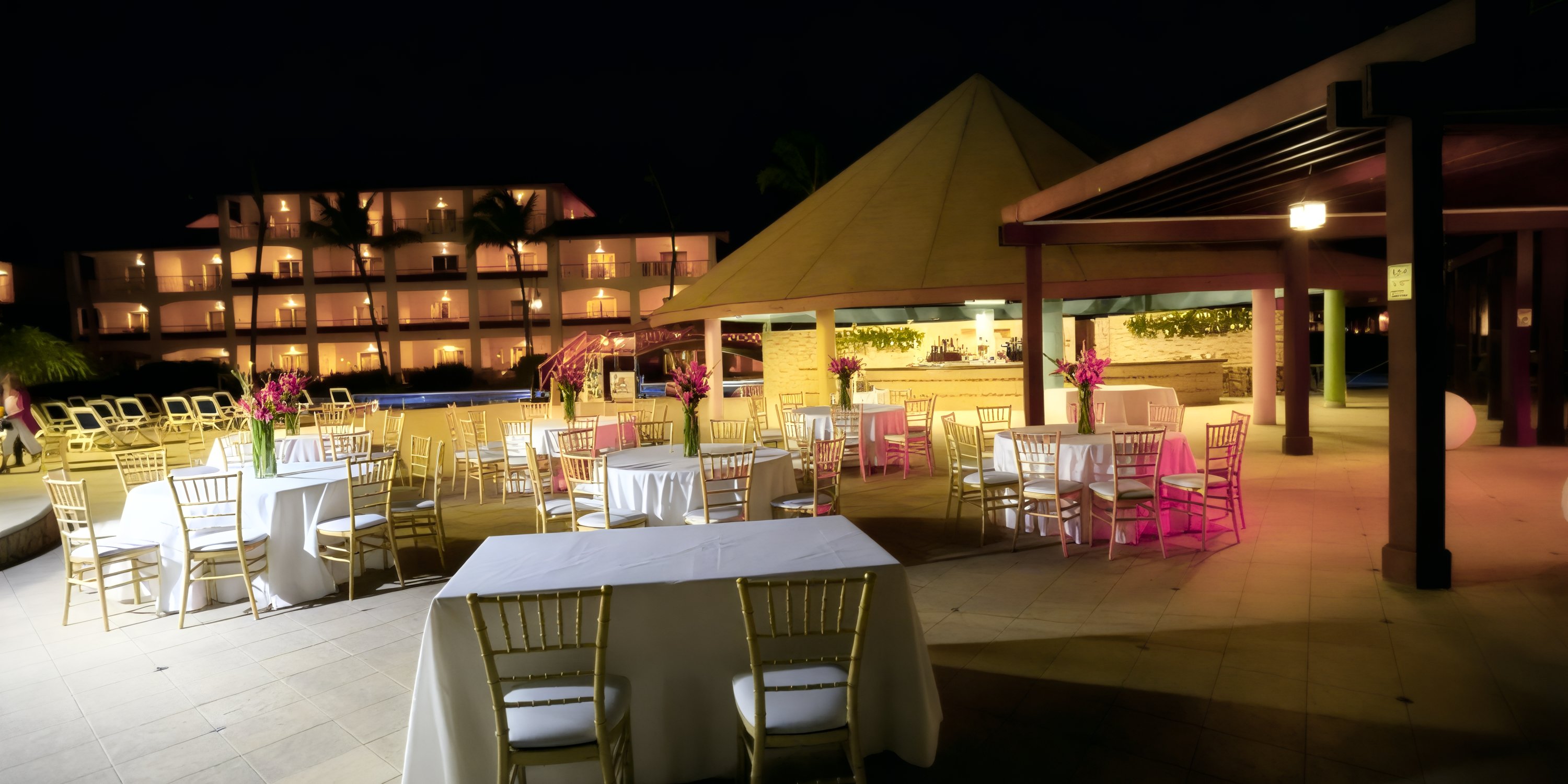 Nighttime outdoor dining setup, perfect for a destination wedding at Majestic Colonial resort.