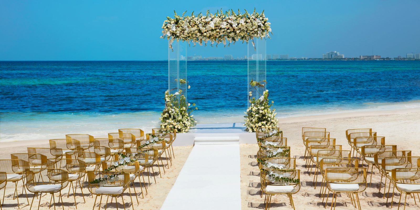 Glamorous beach wedding with canopy at Dreams Vista Cancun Golf & Spa Resort Cancún, Q.R., Mexico
