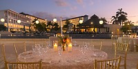 Candlelit poolside dinner at Royalton Blue Waters resort, perfect for a romantic destination wedding.