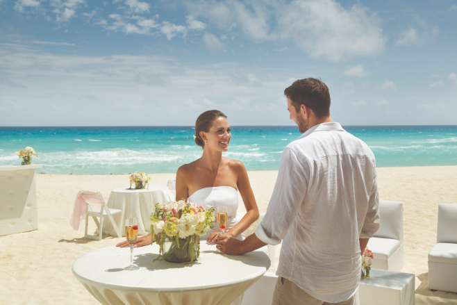 mexico beach wedding cocktail hour panama jack cancun all-inclusive lounge chairs high-tops