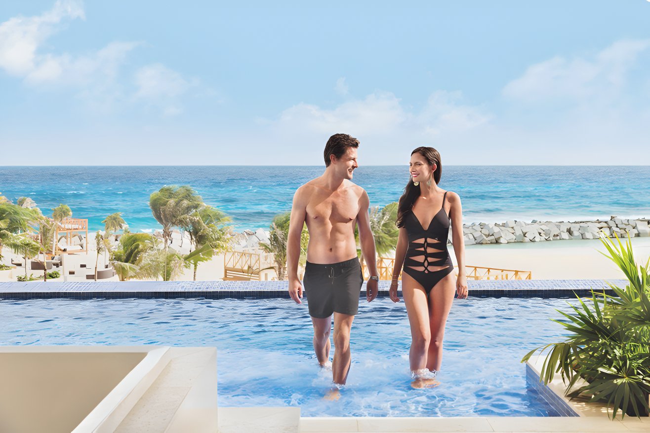 hyatt ziva cancun destination wedding all-inclusive mexico wedding resort infinity pool couple swim-up beach