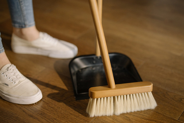 cleaning staff with broom of hotel