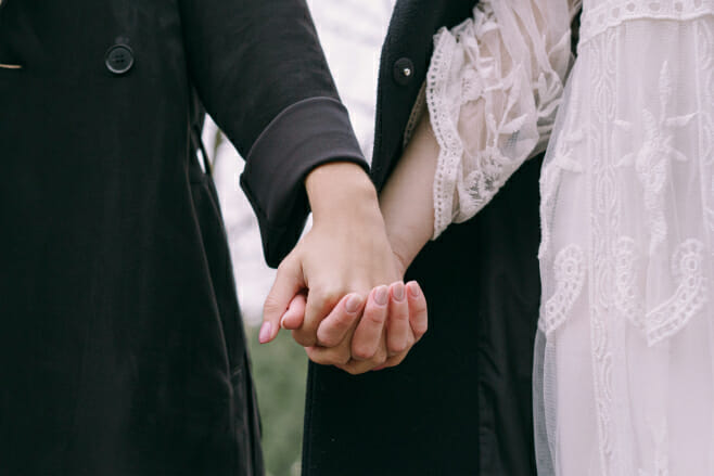 gender neutral wedding terms you should know fiancé holding hands LGBT couple