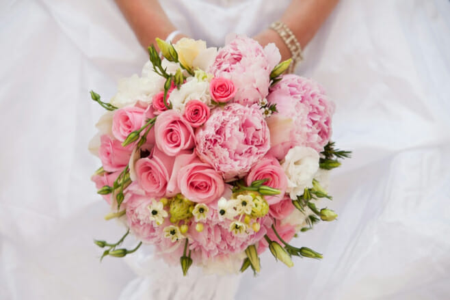 8 spring wedding bouquets that'll dazzle the beach aisle destination weddings pink peony bouquet