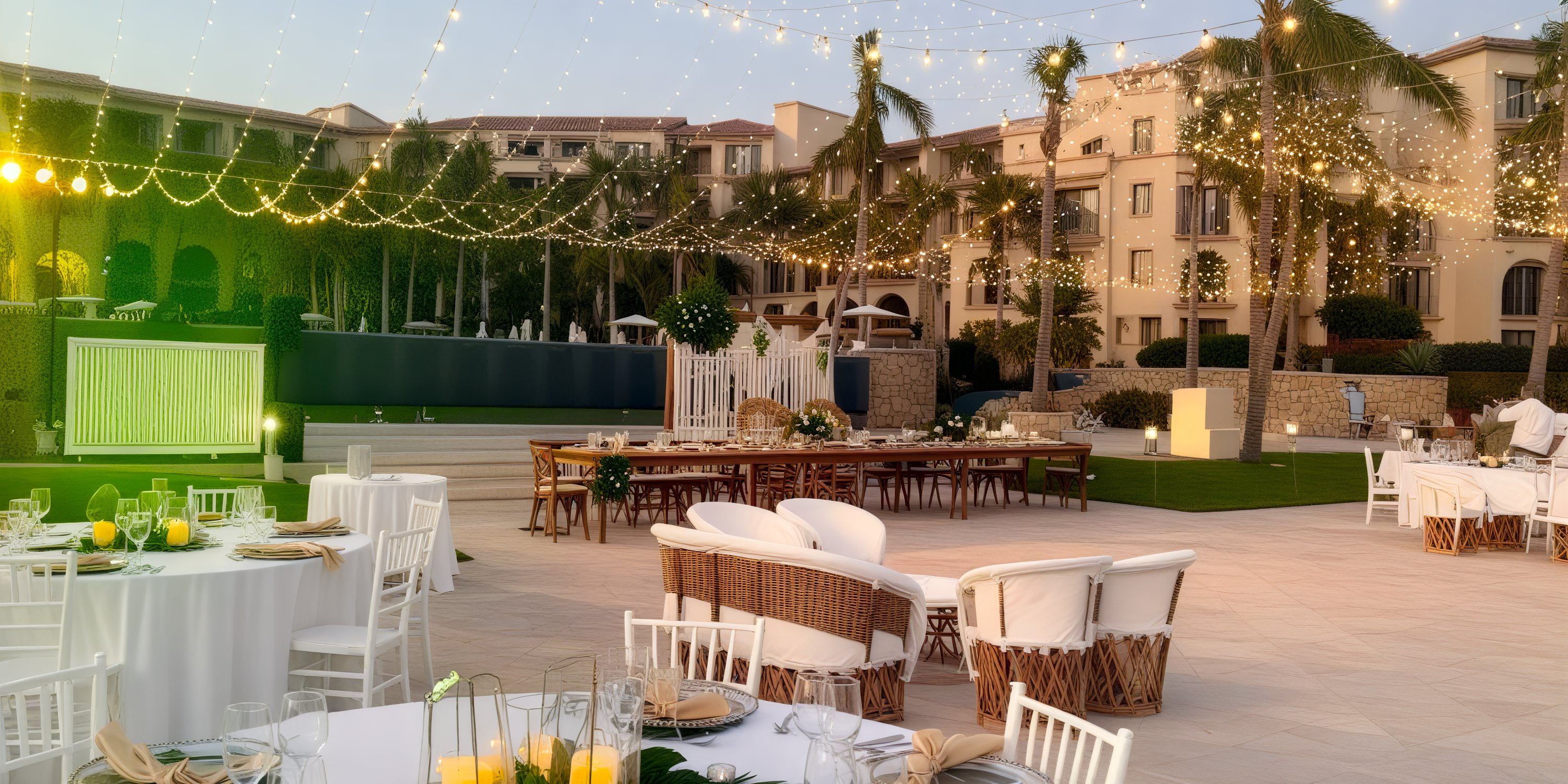 Organize a destination wedding at Dreams Los Cabos, featuring tables, chairs, and enchanting string lights for a magical outdoor celebration.