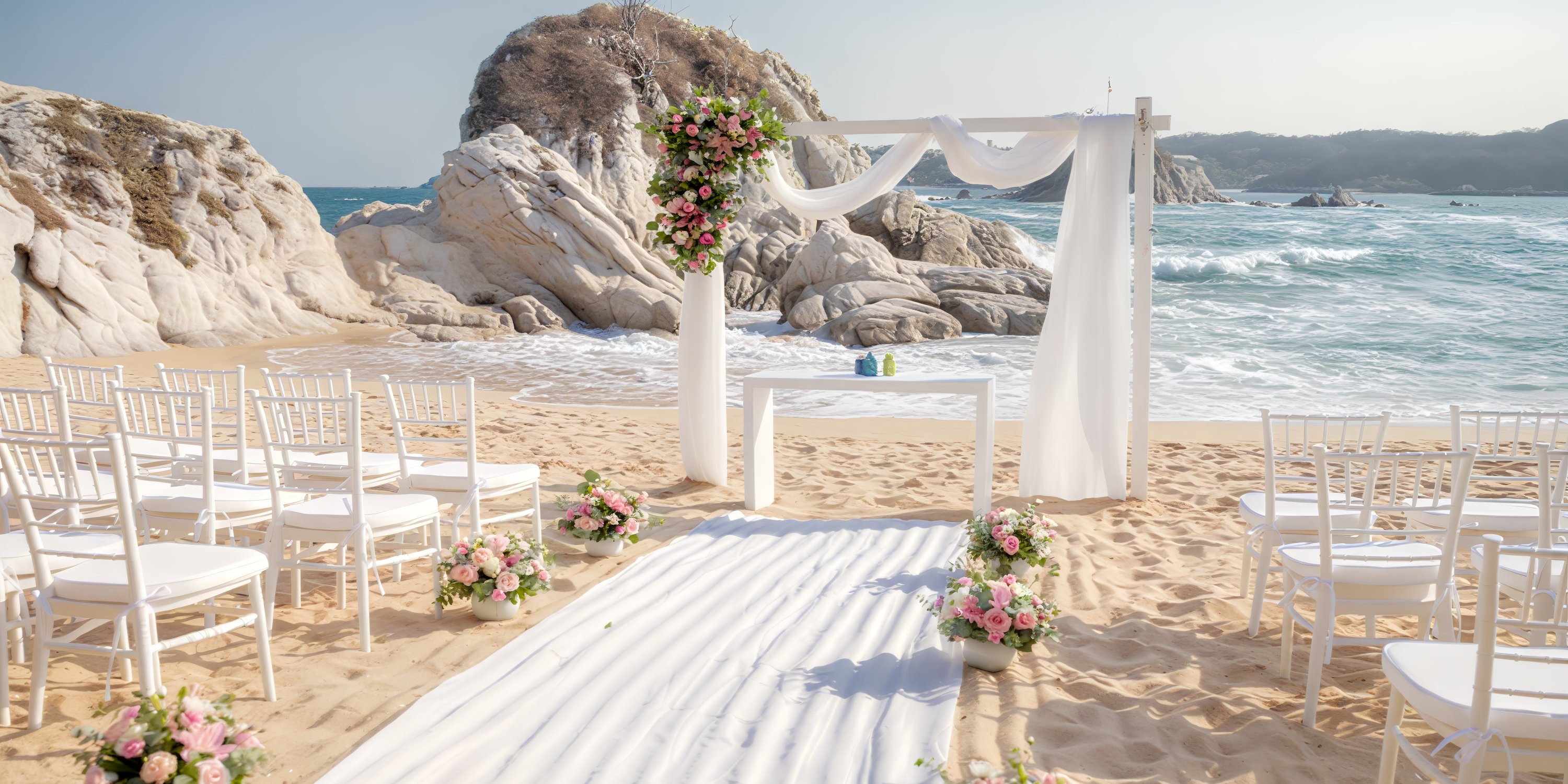 A destination wedding at Dreams Huatulco, with white chairs, floral decor, and an arch beside the ocean.