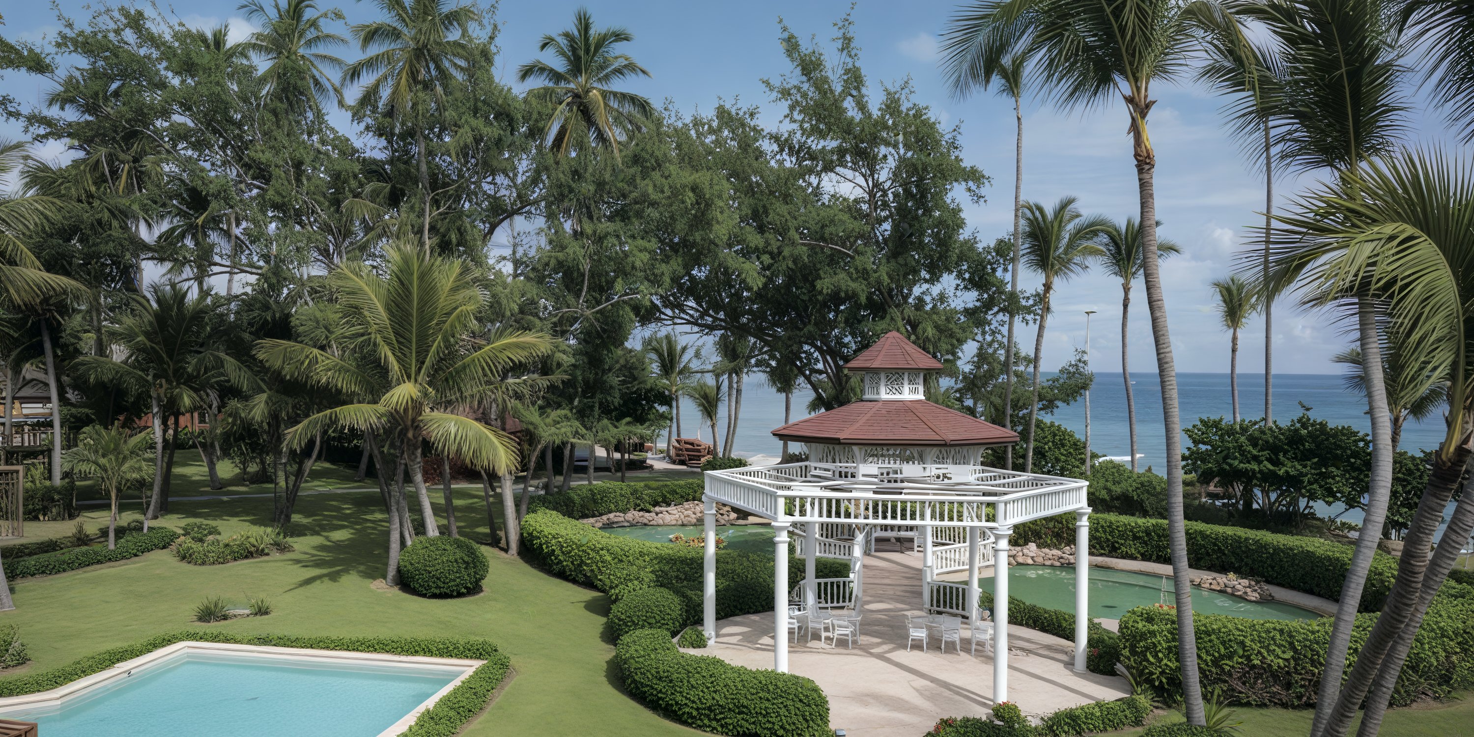 Gazebo by the pool at Grand Palladium Palace, perfect for a destination wedding with ocean views.