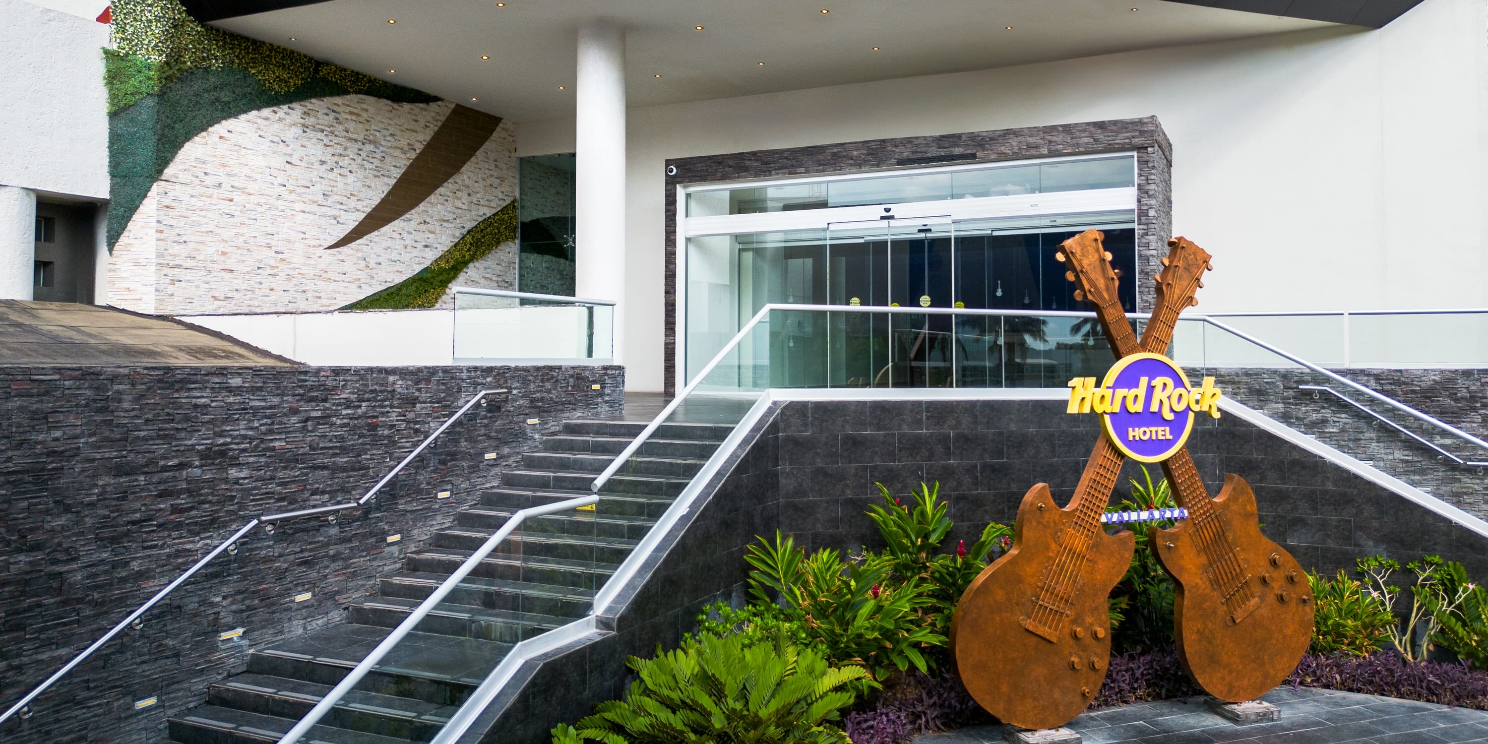Outdoor staircase at the Hard Rock Vallarta, a popular destination wedding entrance with a guitar.
