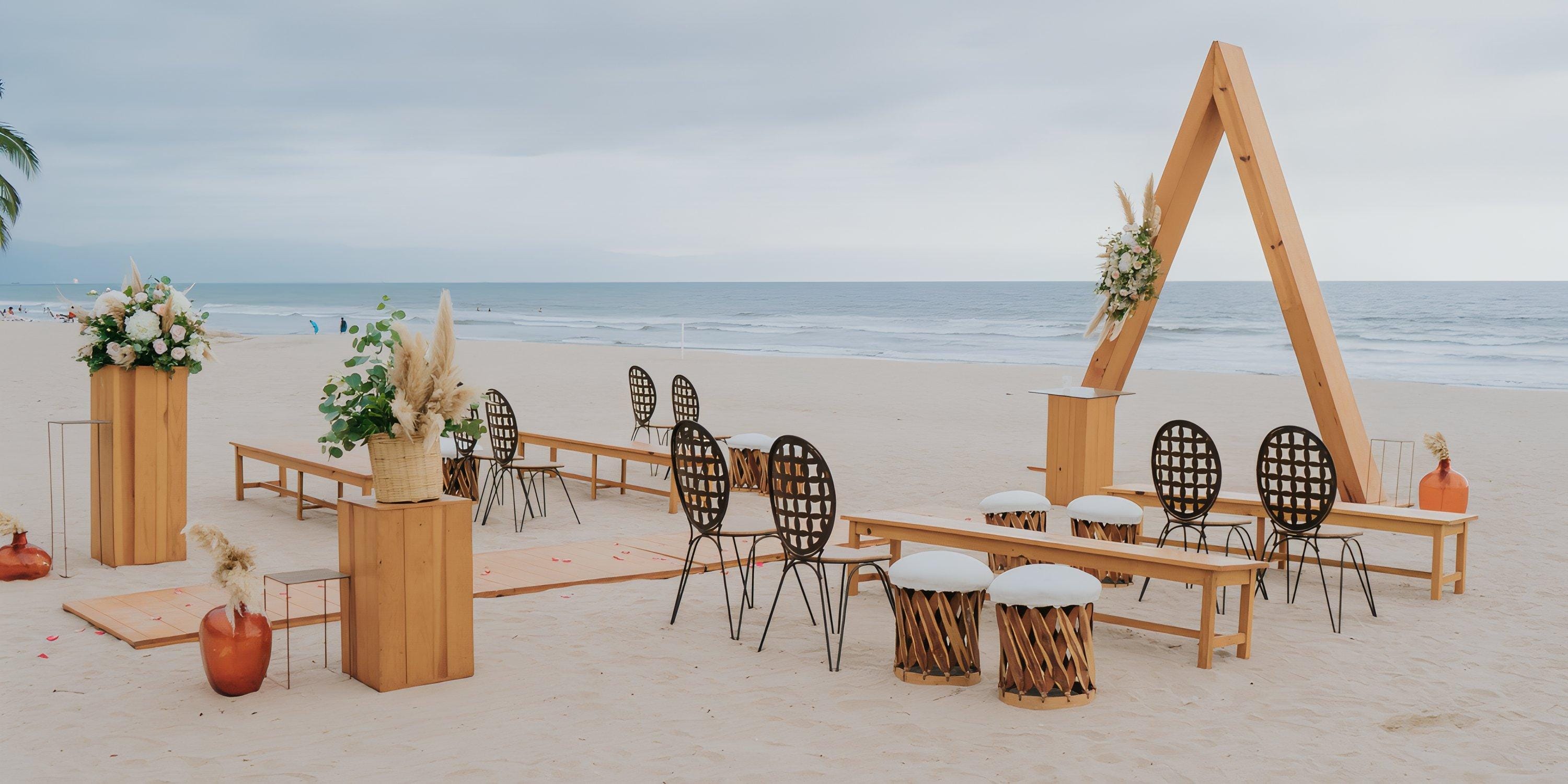 Destination wedding setup at Hard Rock Vallarta: beach altar, florals, and chairs by the ocean.