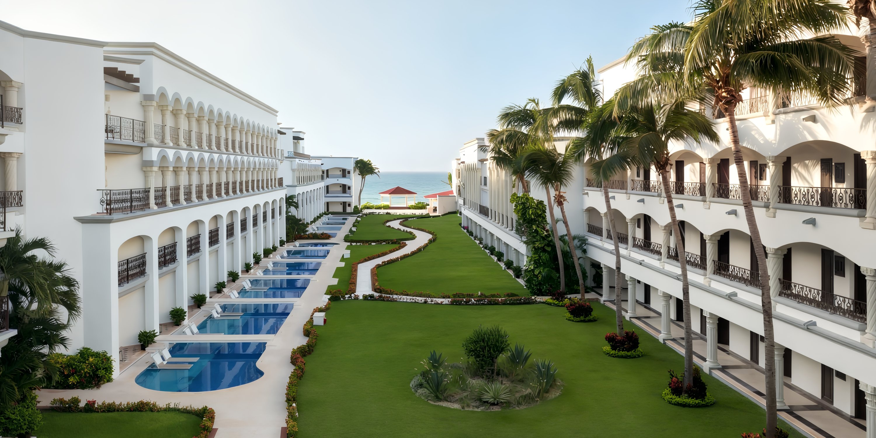 Hyatt Vivid Playa del Carmen: Beachfront wedding resort with pools, gardens, and ocean views.