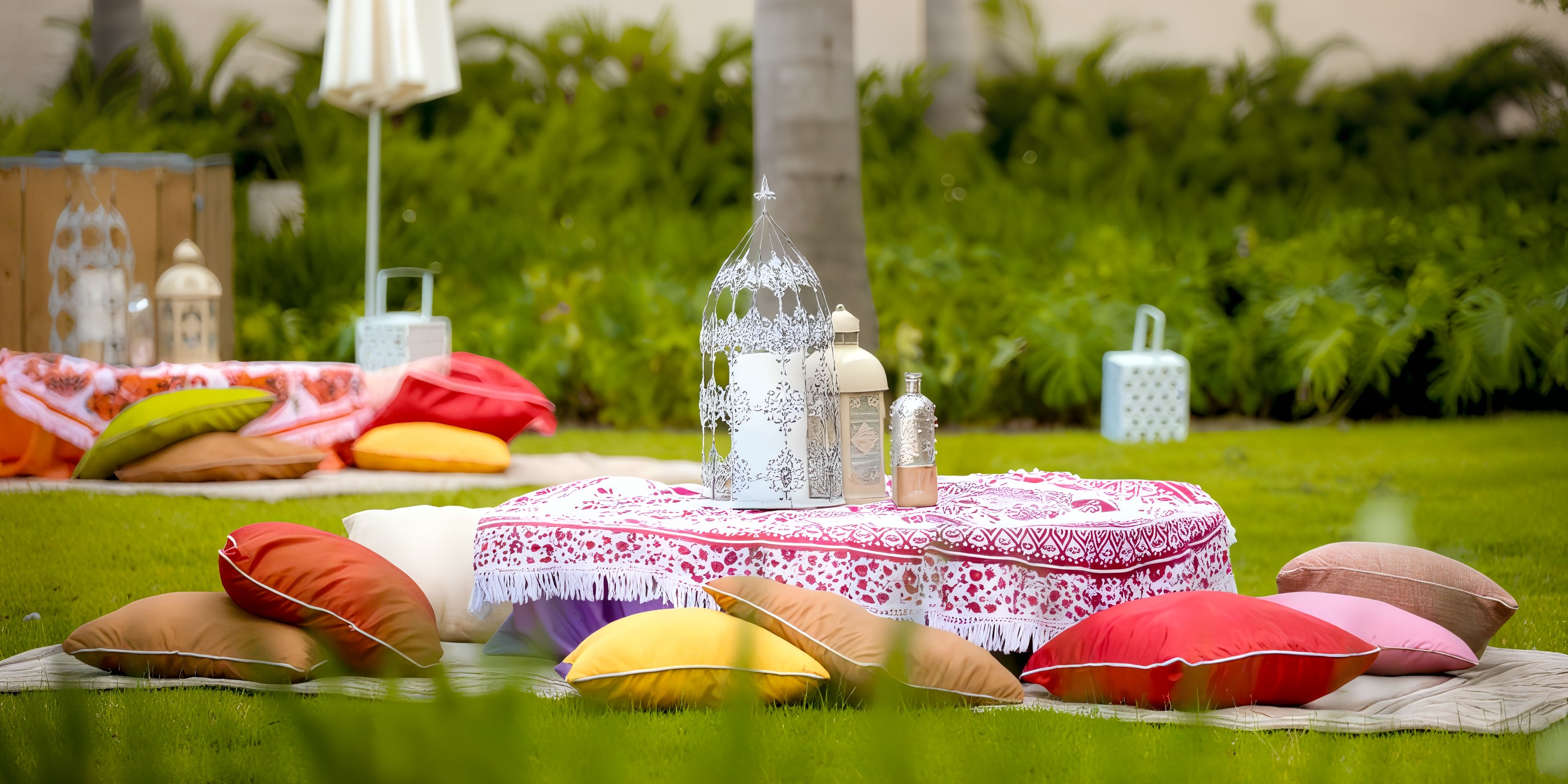Hyatt Zilara Cap Cana: destination wedding picnic with vibrant pillows, patterned cloth, and lanterns.