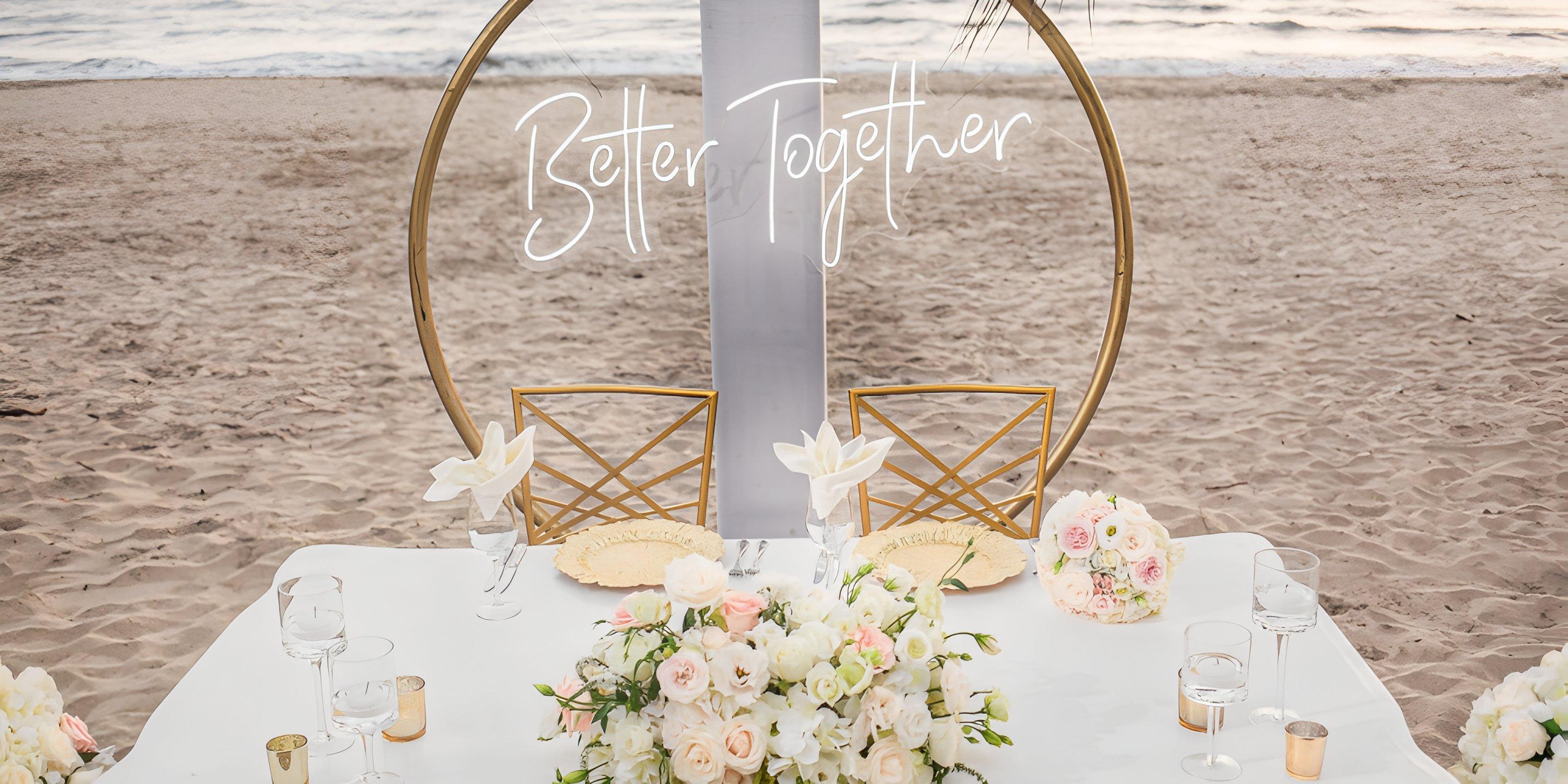 Destination wedding table at Hard Rock Vallarta with flowers, glassware, and a "Better Together" sign.