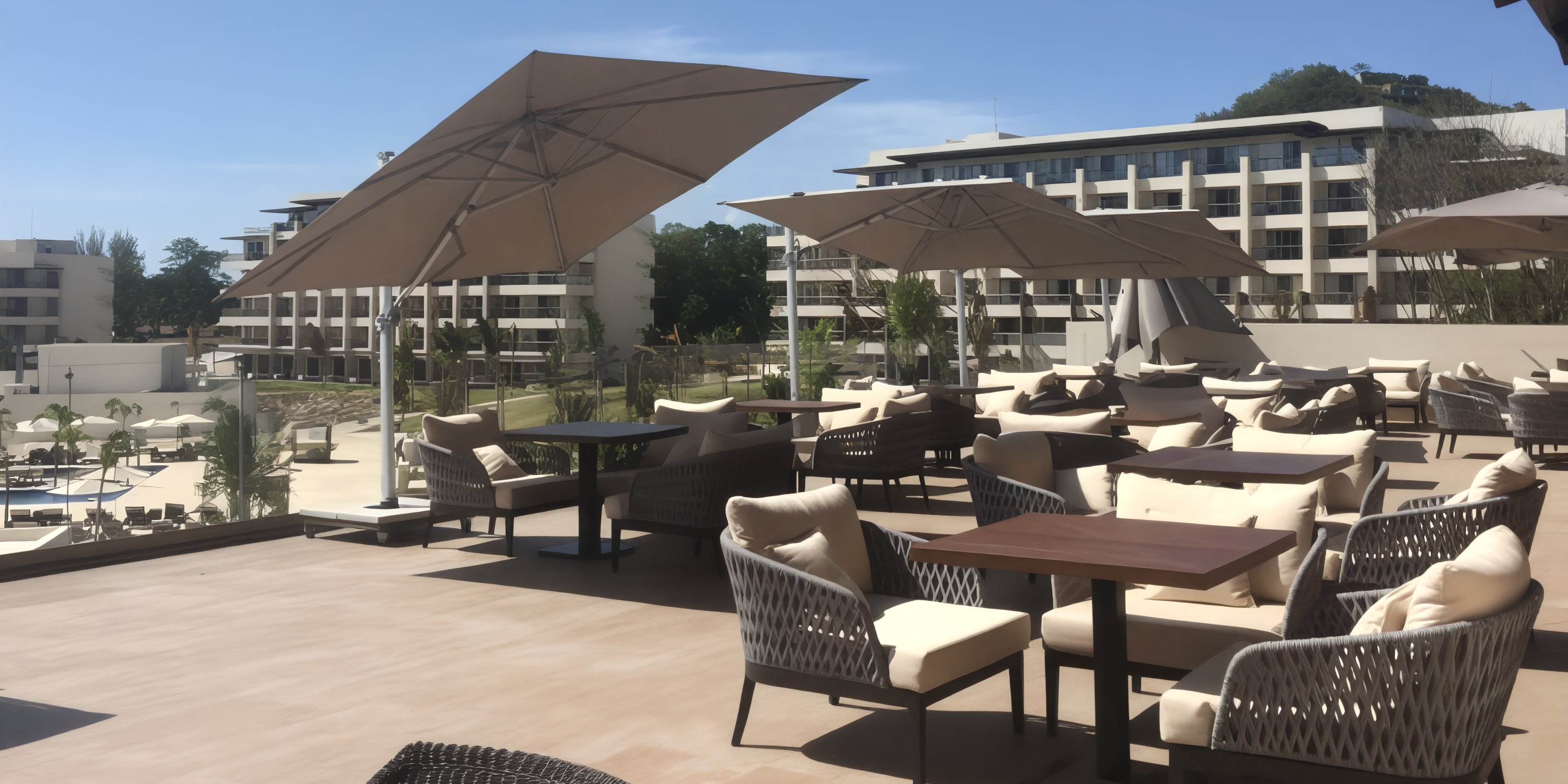 Outdoor terrace with cushioned chairs and umbrellas, perfect for a destination wedding at Royalton St. Lucia.