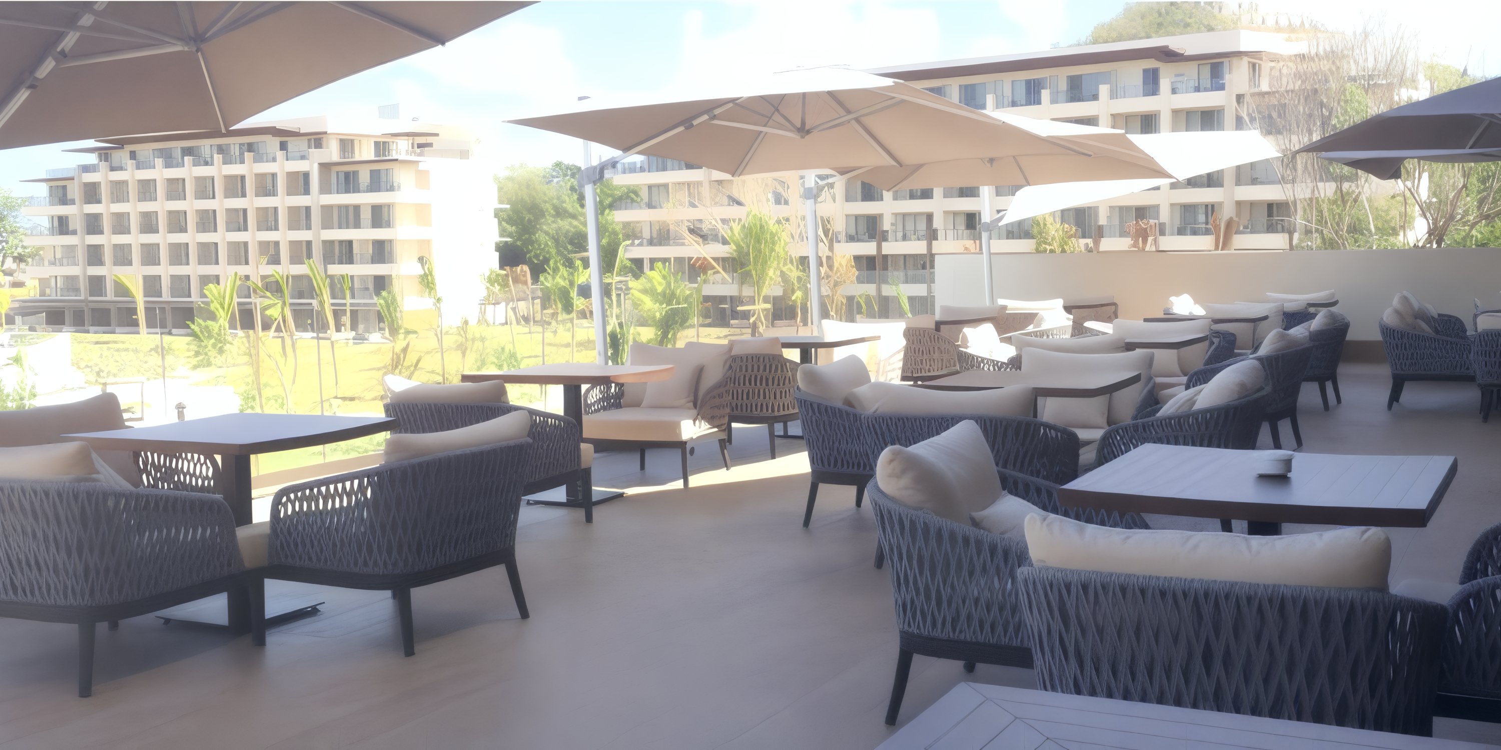 Perfect for a destination wedding, Hideaway at Royalton St. Lucia offers patio seating with wicker chairs and umbrella shade.