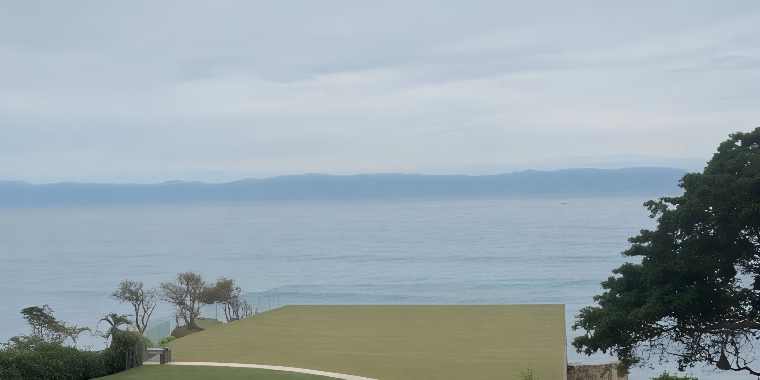 Dreams Bahia Mita provides a stunning setting for a destination wedding with its ocean views framed by majestic mountains, an overcast sky, and charming grassy rooftops.
