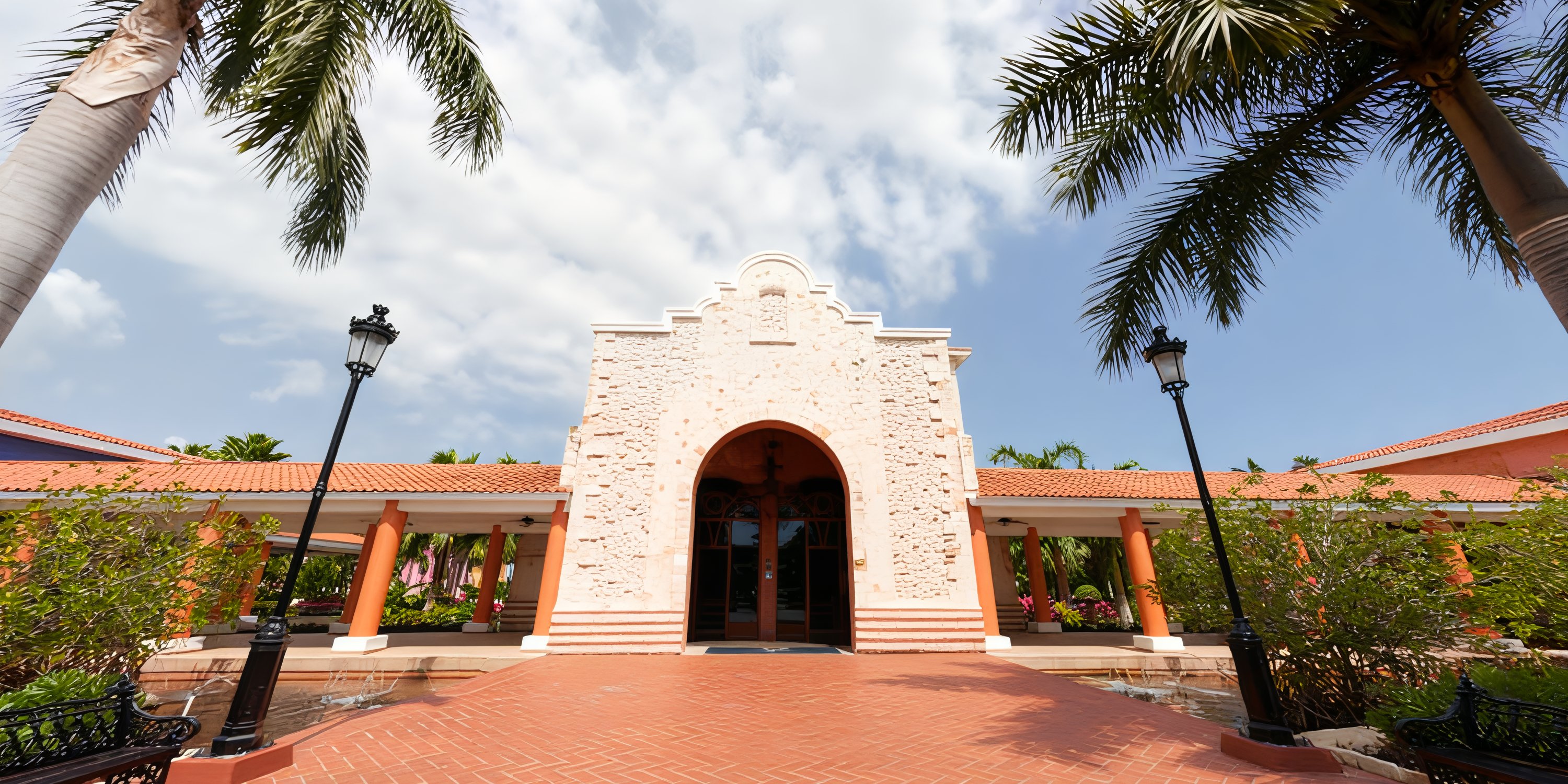 Iberostar Selection Paraiso Lindo, with its brick walkway and palm trees, makes a scenic wedding spot.