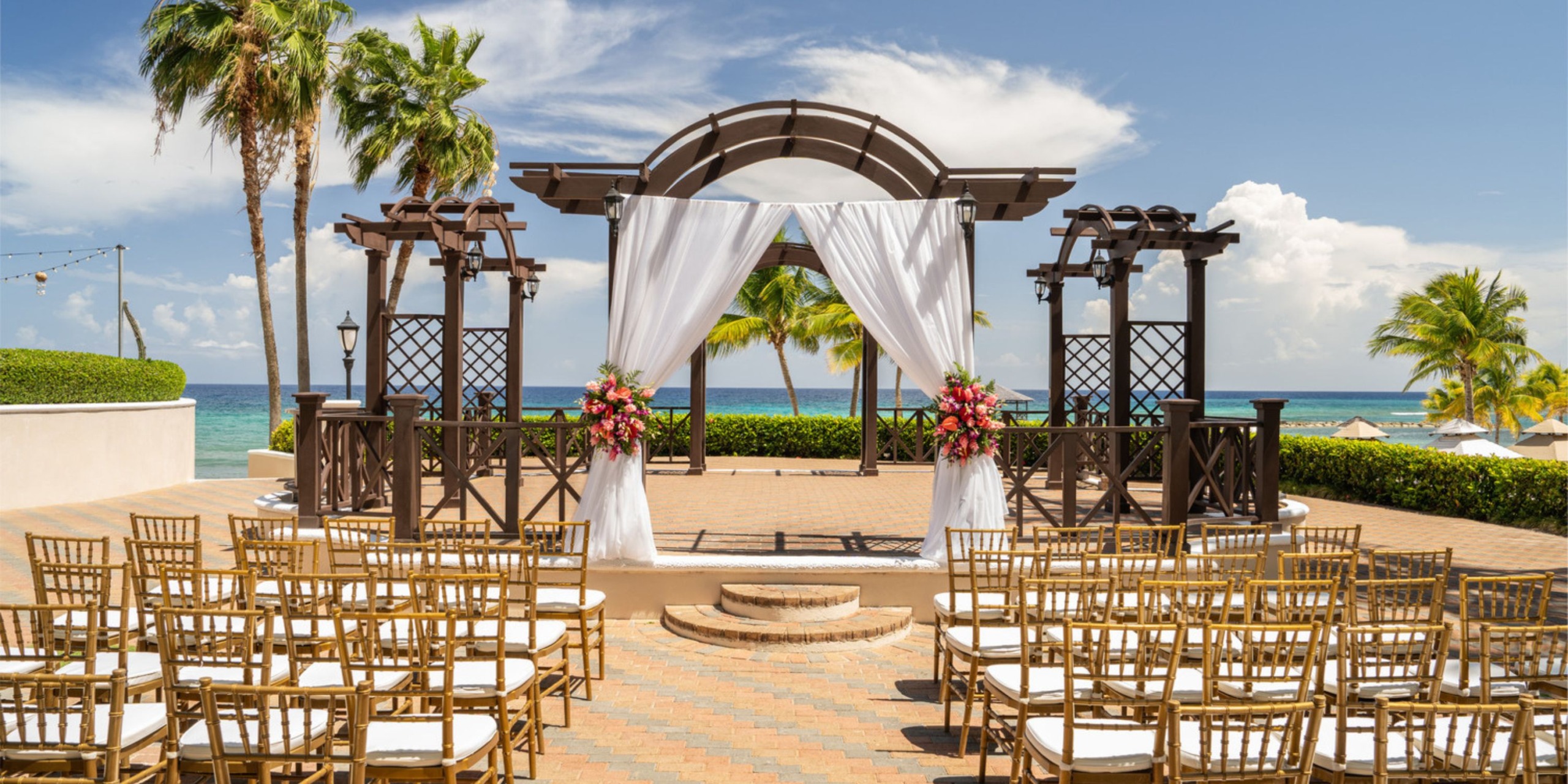 A stunning beachfront wedding gazebo with seating awaits at the Jewel Grande Montego Bay Resort & Spa, perfect for your dream destination wedding.