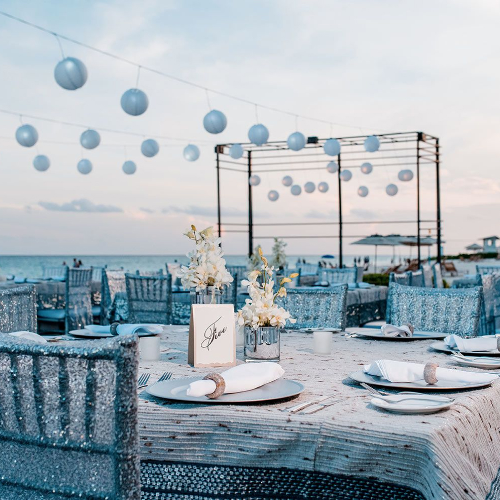Outdoor beach venue sitting on white sand with a gazebo set up for a destination wedding