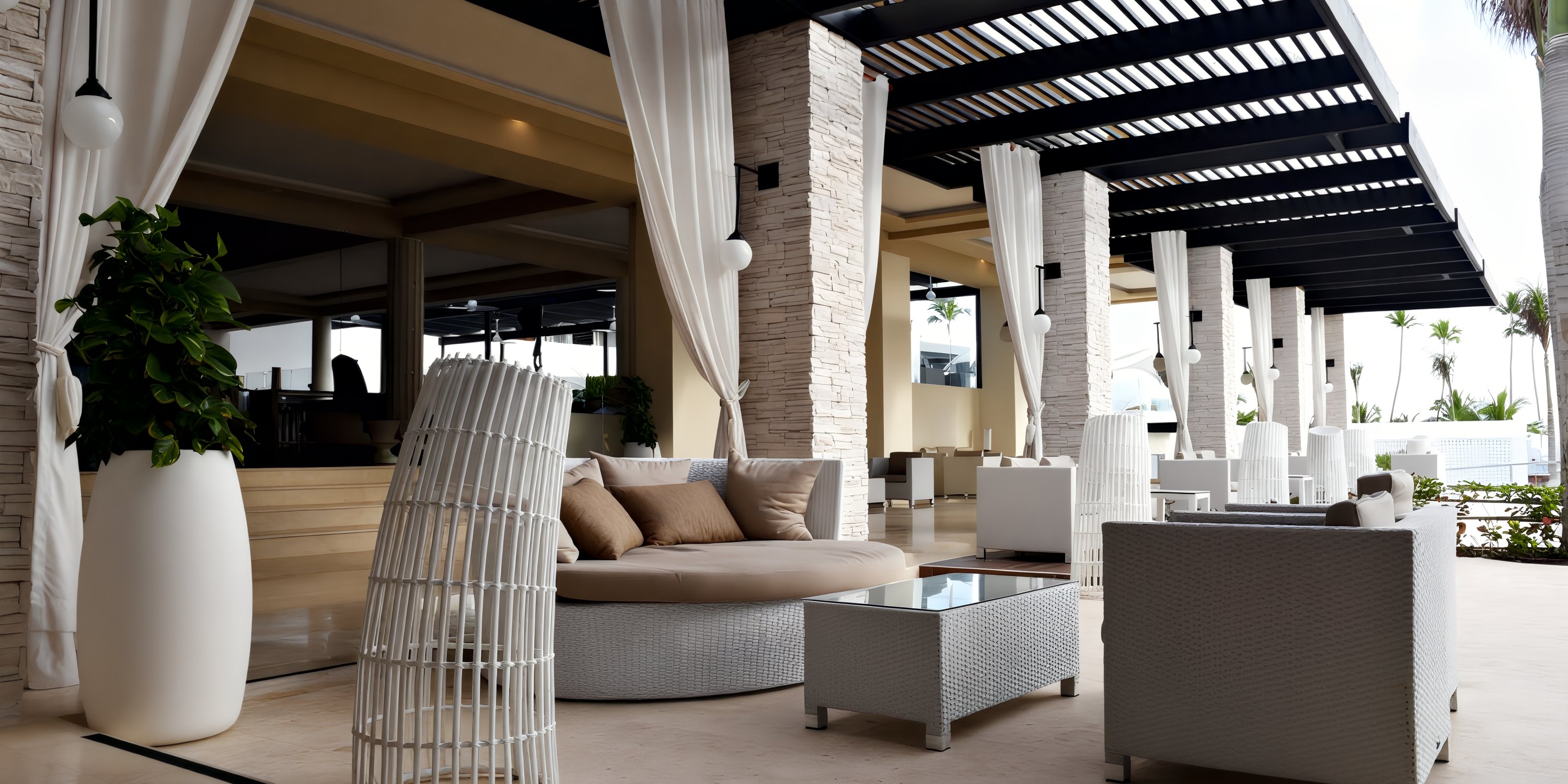 Chic outdoor lounge at Royalton CHIC Punta Cana, ideal for destination weddings, with white wicker seats.