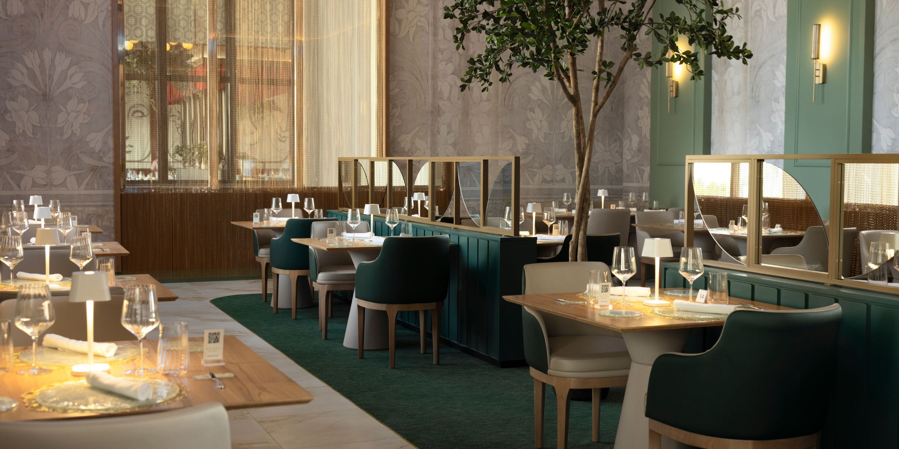 Hotel Riu Palace Aruba: Dreamy dining for a destination wedding, green chairs, set tables, plants.