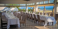 Two long tables arranged for a destination wedding at Hotel Riu Jalisco with an ocean view.