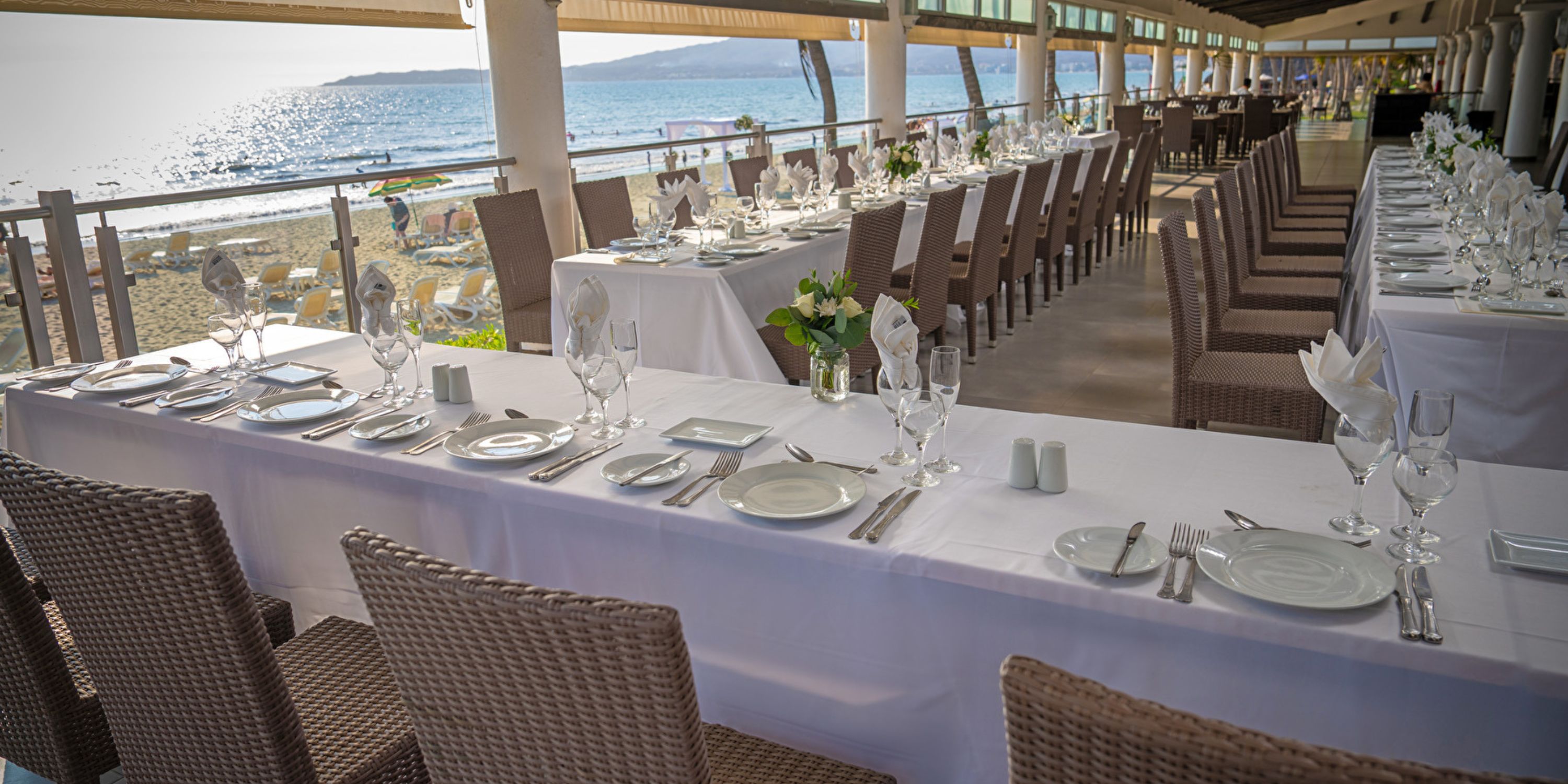 Hotel Riu Jalisco is perfect for a destination wedding with beach views and elegant white table settings.