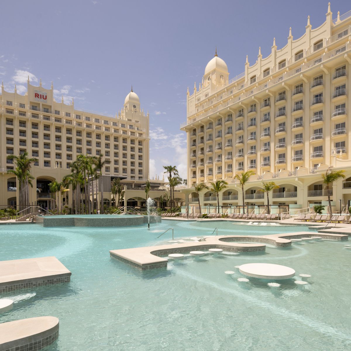 Riu Palace Aruba: Great for destination weddings, with palms, pool, fountains, and in-water seating.