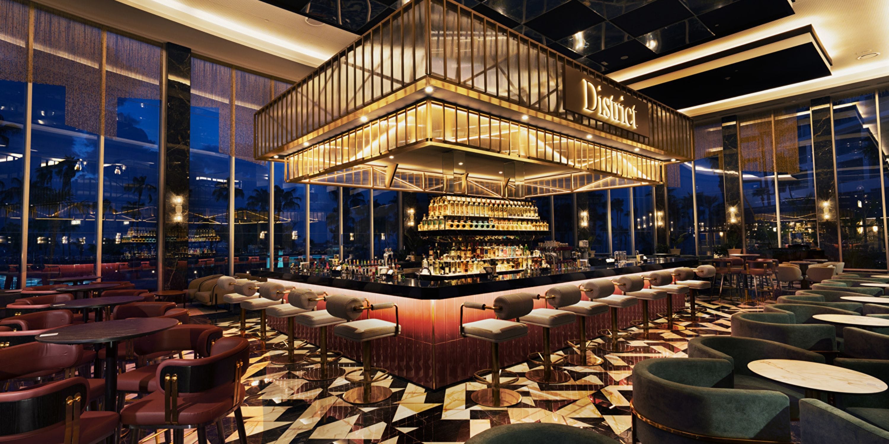 Chic bar at Hotel Riu Palace Peninsula, perfect for a destination wedding with plush seats and glow.