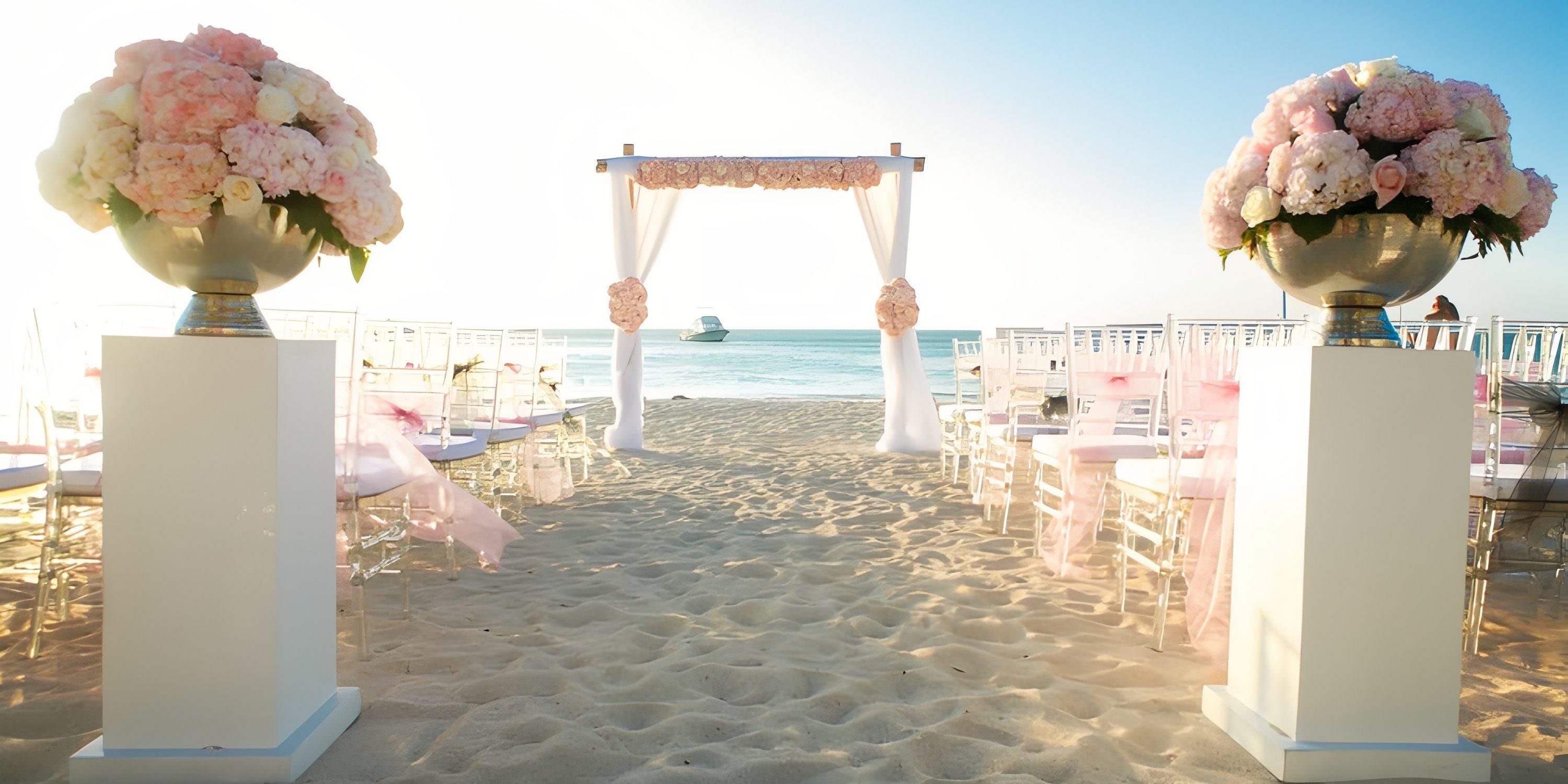 Destination wedding at Hotel Riu Palace Antillas featuring florals, white chairs, and ocean-view arch.