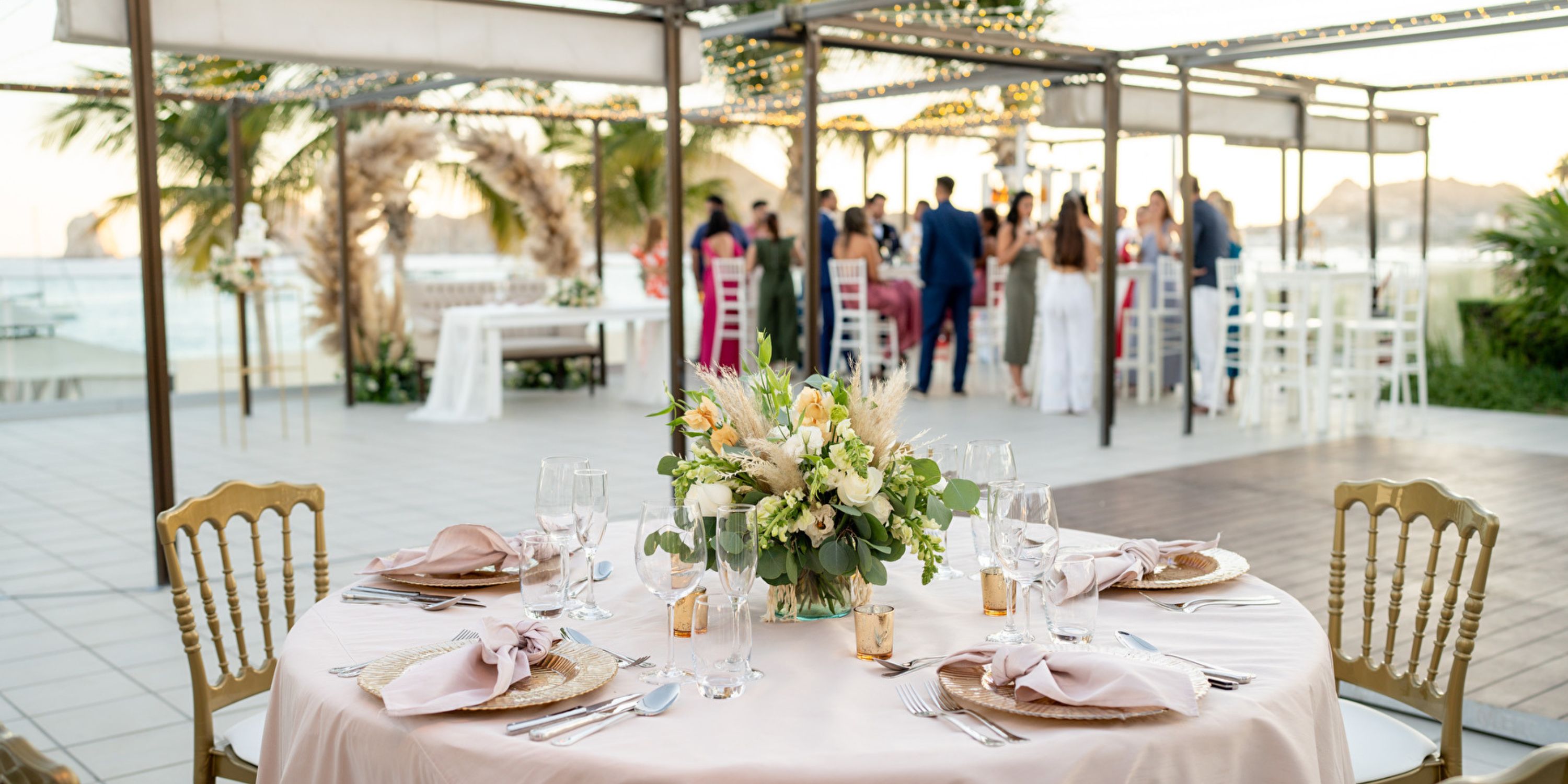 Round table with floral centerpiece set for a destination wedding at Hotel Riu Palace Baja California.