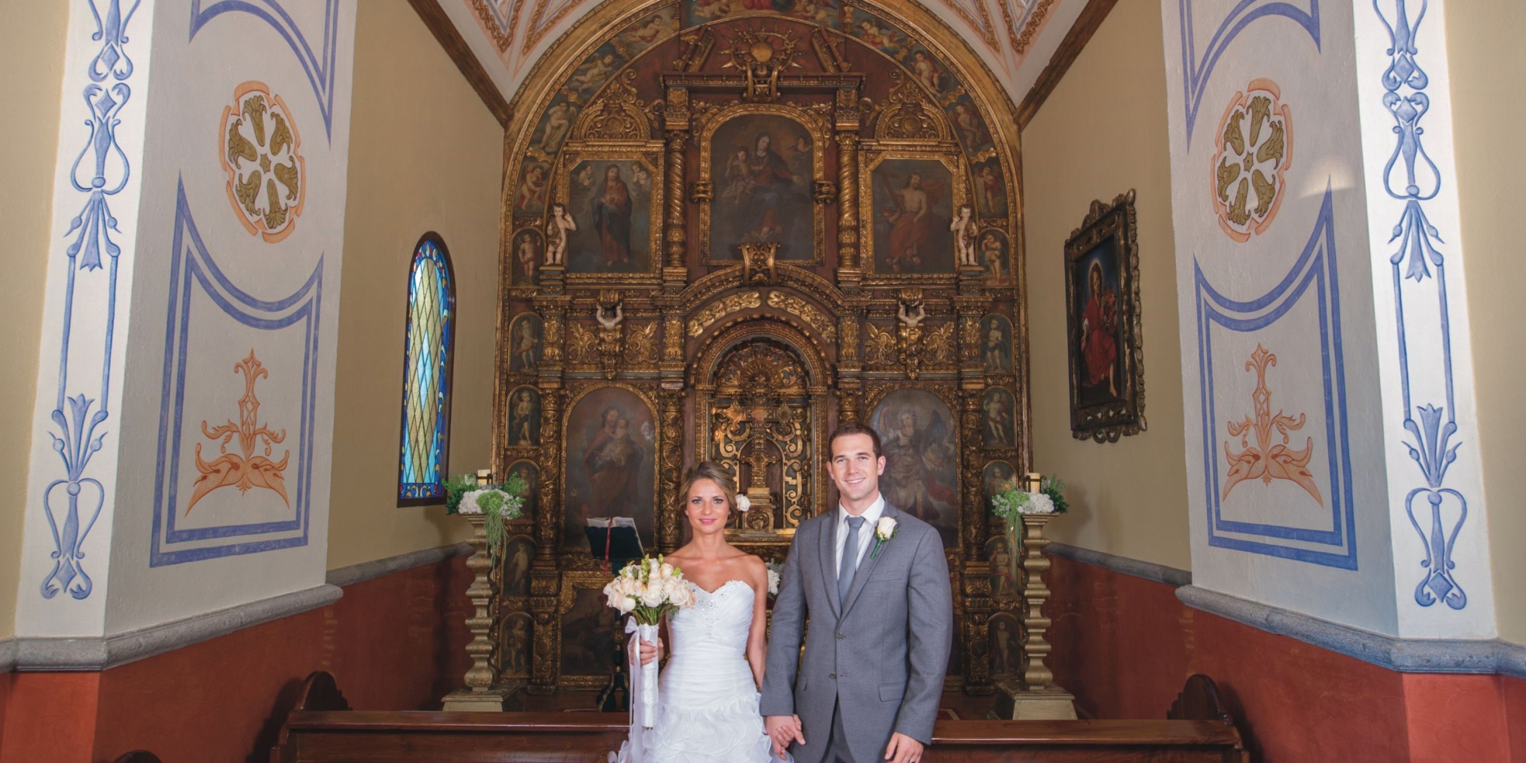 Bride and groom pose for a wedding photo at Hotel Riu Palace Mexico during their destination wedding.