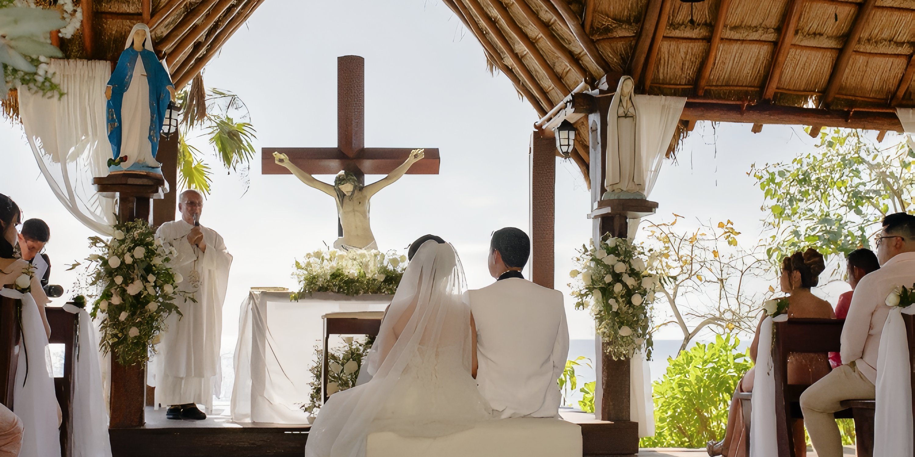 A couple holds their destination wedding at Secrets Aura Cozumel, seated at a chapel altar with a priest.