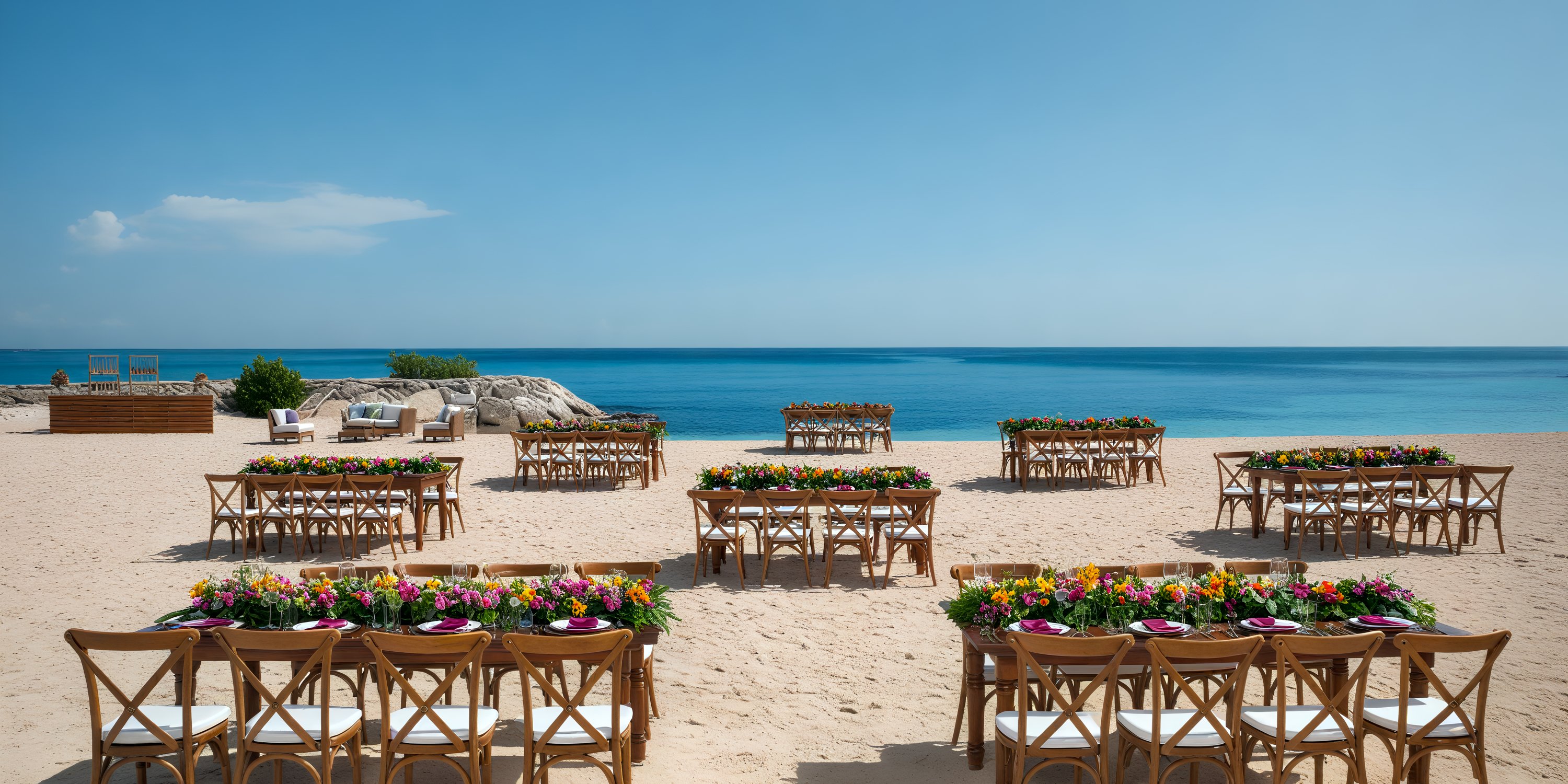 A destination wedding setup featuring wooden chairs and floral decor at Secrets St. James Montego Bay.