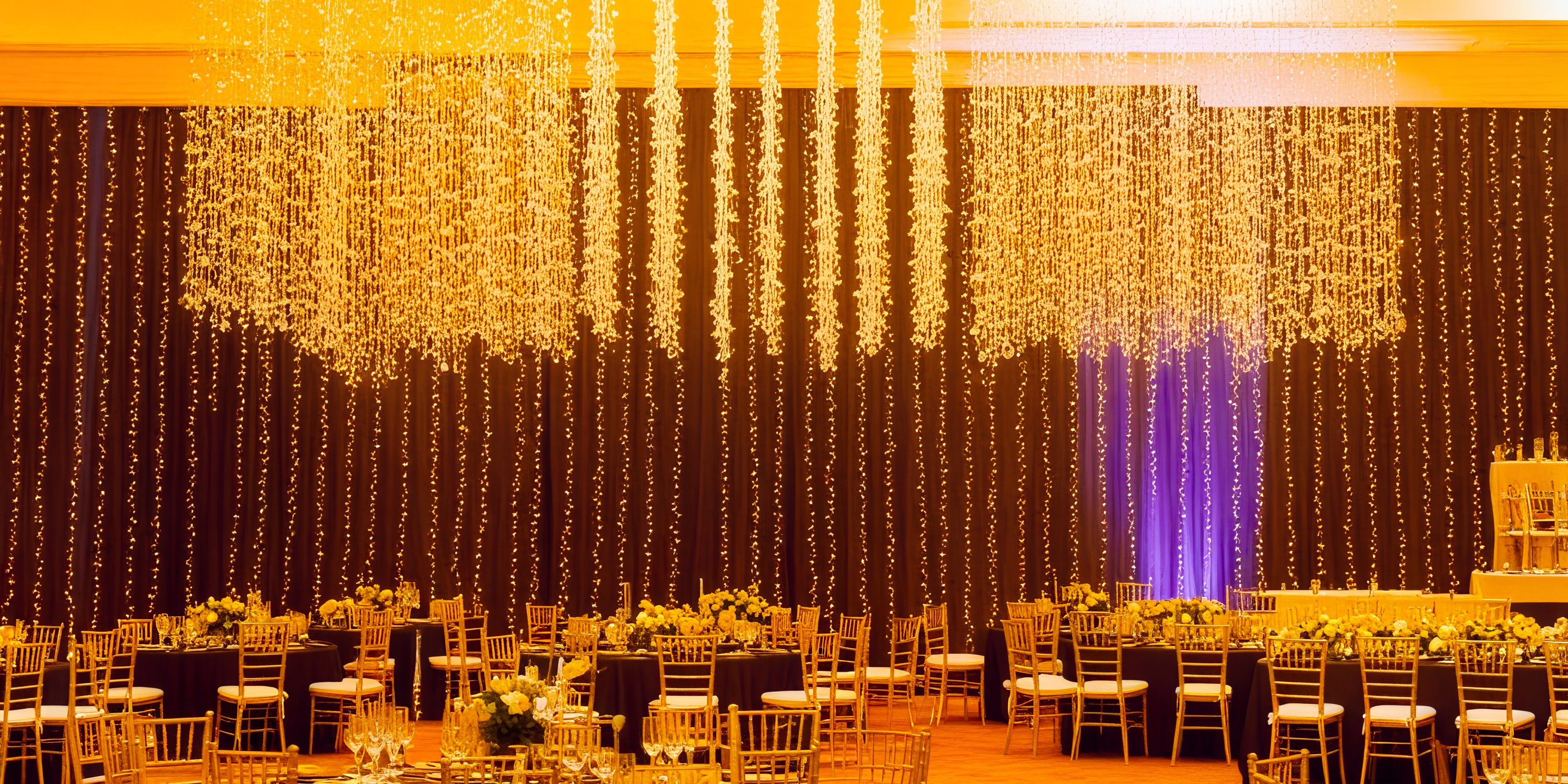 The elegant ballroom at Secrets Vallarta Bay, adorned with string lights and event-ready tables, sets the perfect scene for a destination wedding.
