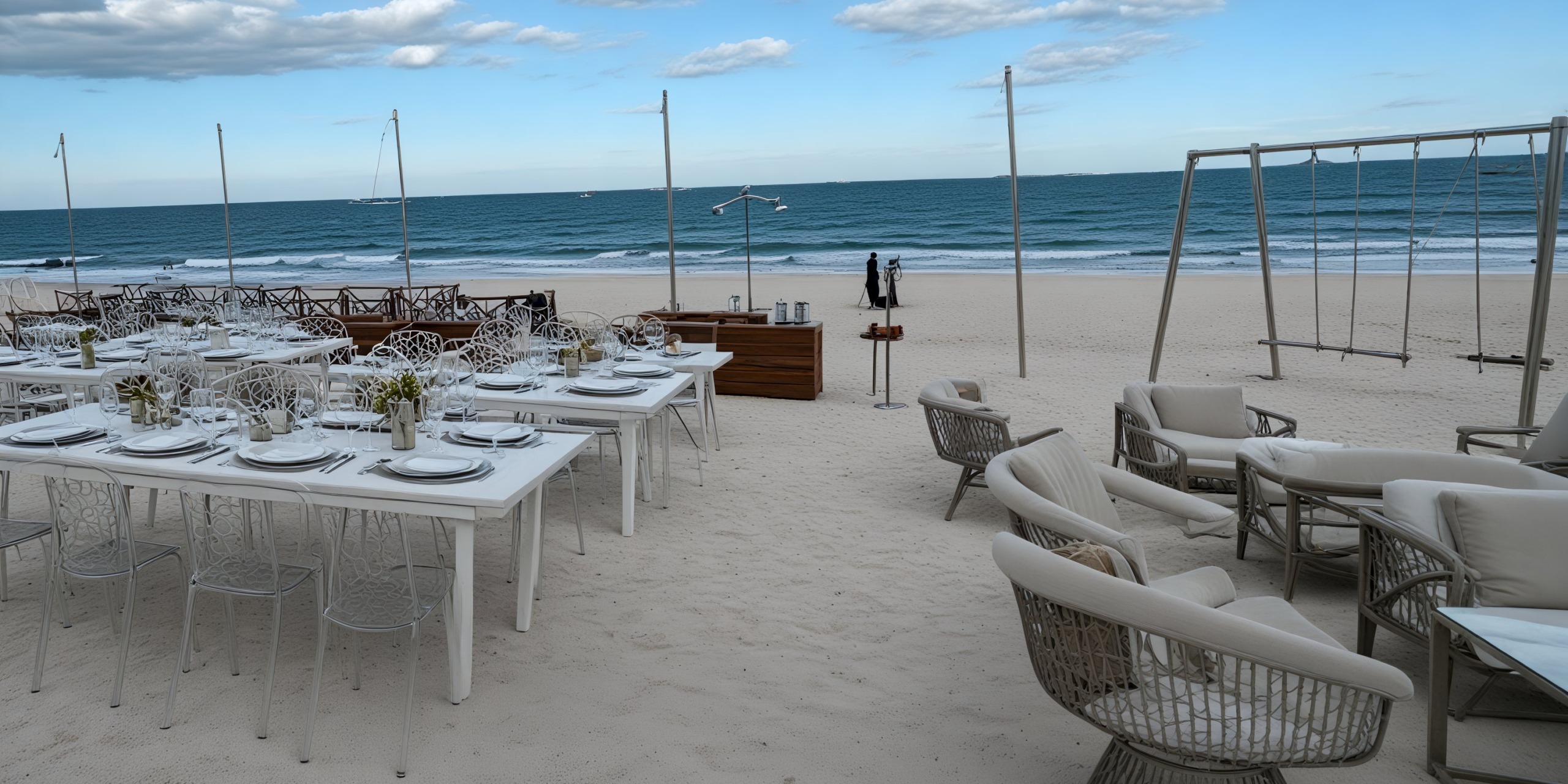 Secrets Maroma Beach provides an idyllic destination wedding setting, featuring beachfront arrangements with white tables, chairs, and stunning ocean views.