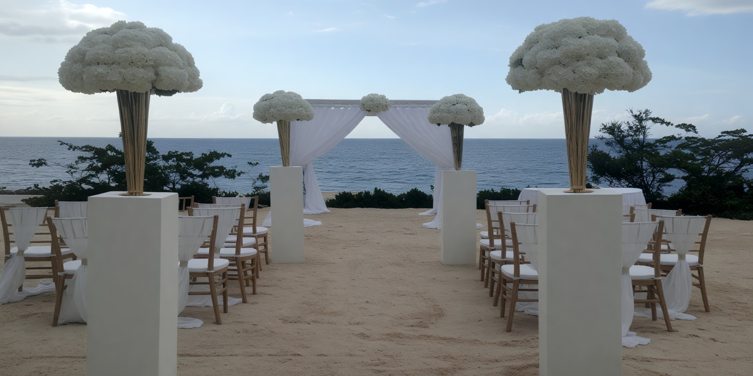Secrets Wild Orchid provides a stunning beachfront setting for your destination wedding, complete with elegant chairs, beautiful floral arrangements, and a classic white archway.