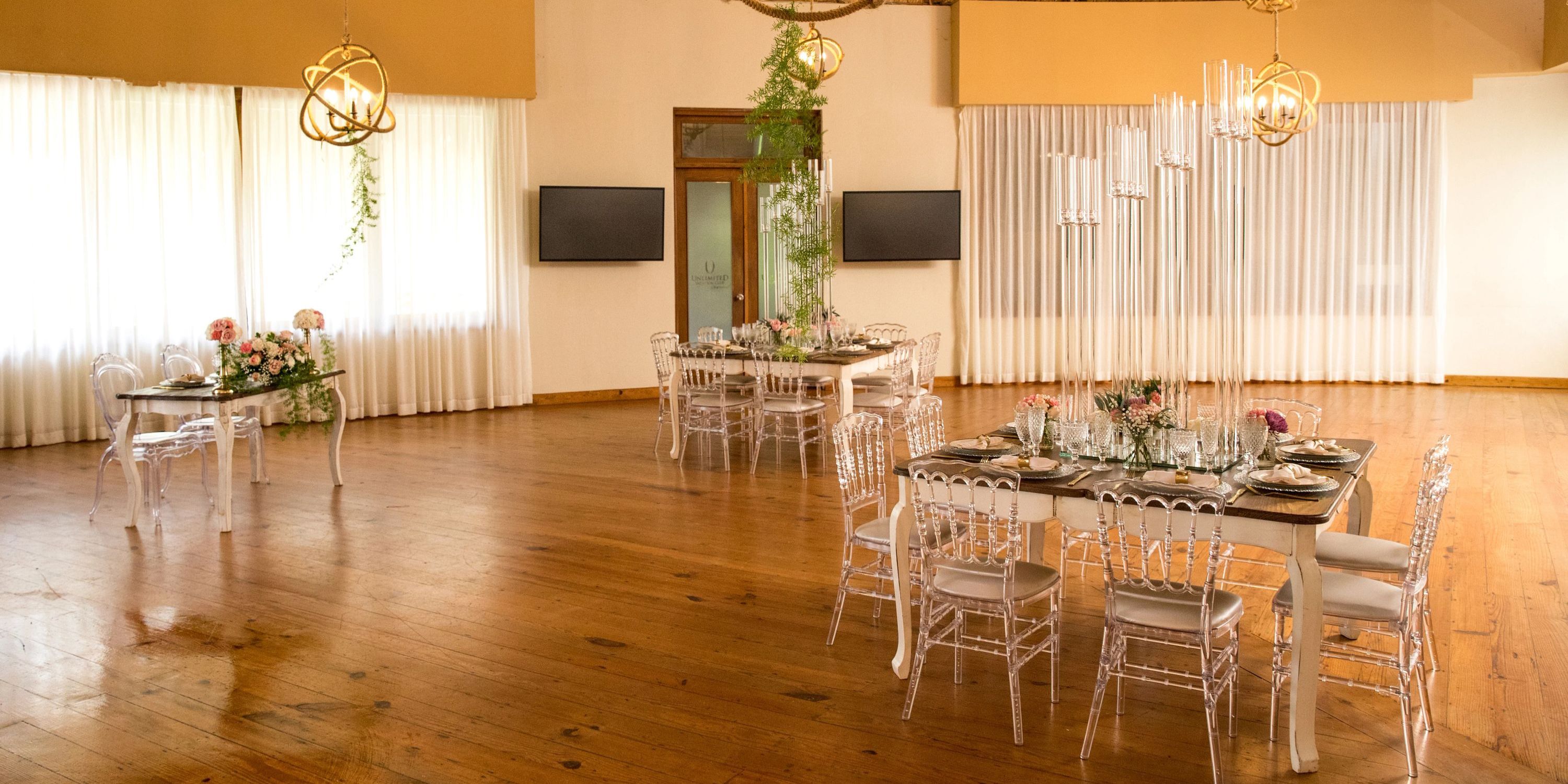 Zoetry Agua Punta Cana is a chic destination wedding venue with wooden floors, floral decor, and stylish tables.
